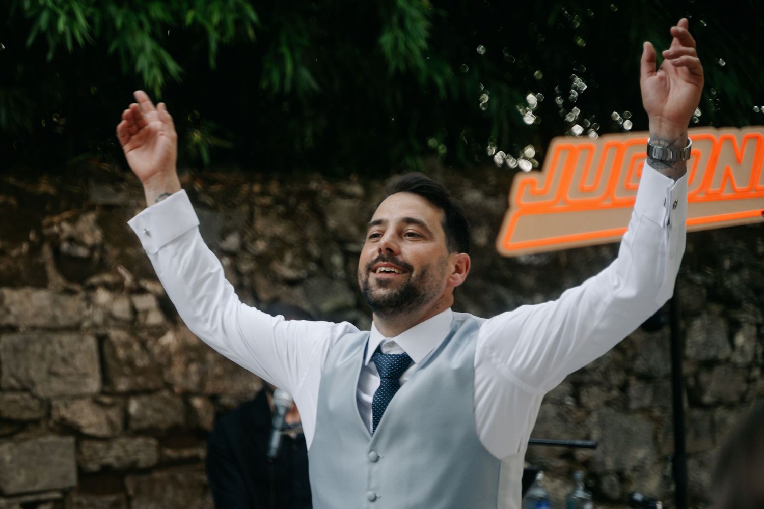 A series of wedding celebration photos showing joyful moments with raised arms and expressions of happiness outdoors.