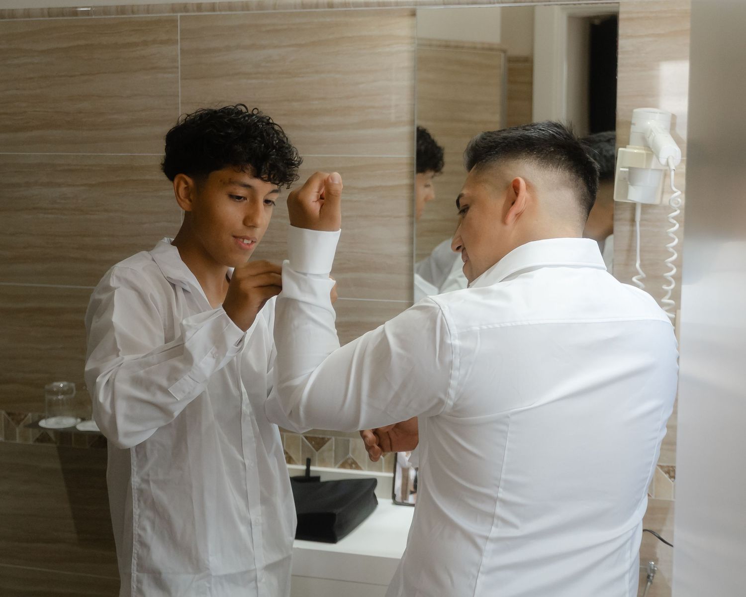 Two people in white shirts demonstrate martial arts moves in a series of connected action shots.