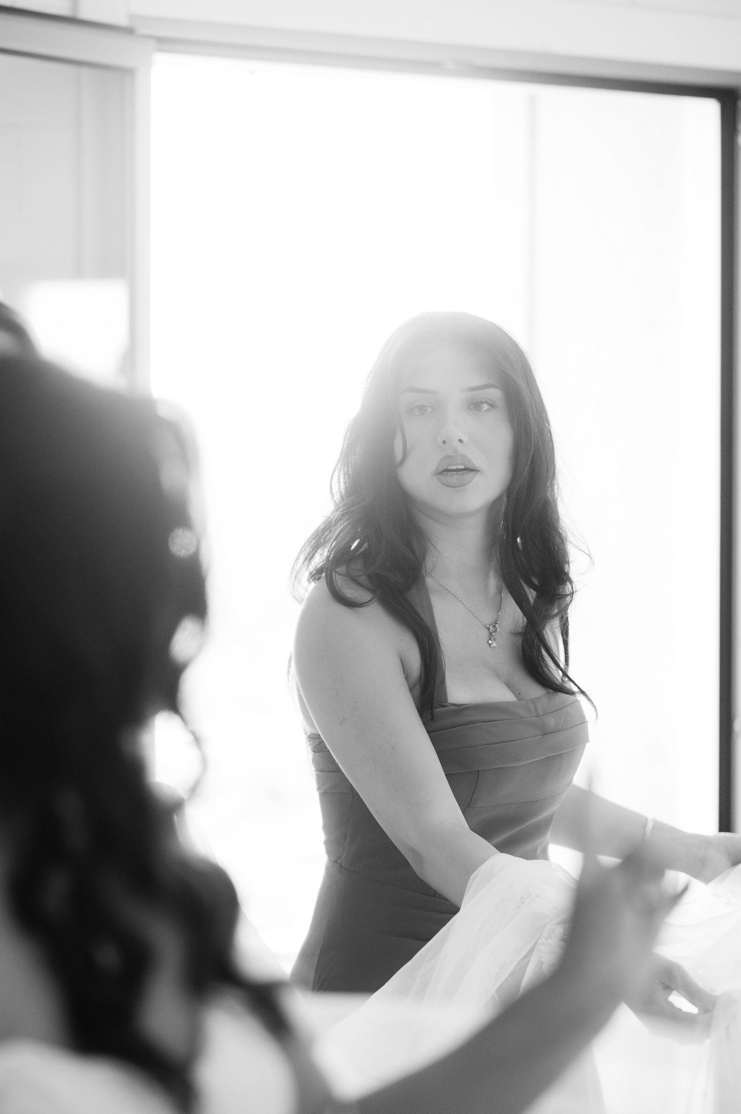 Artistic black and white sequence showing silhouettes of a figure in soft focus with flowing movement.