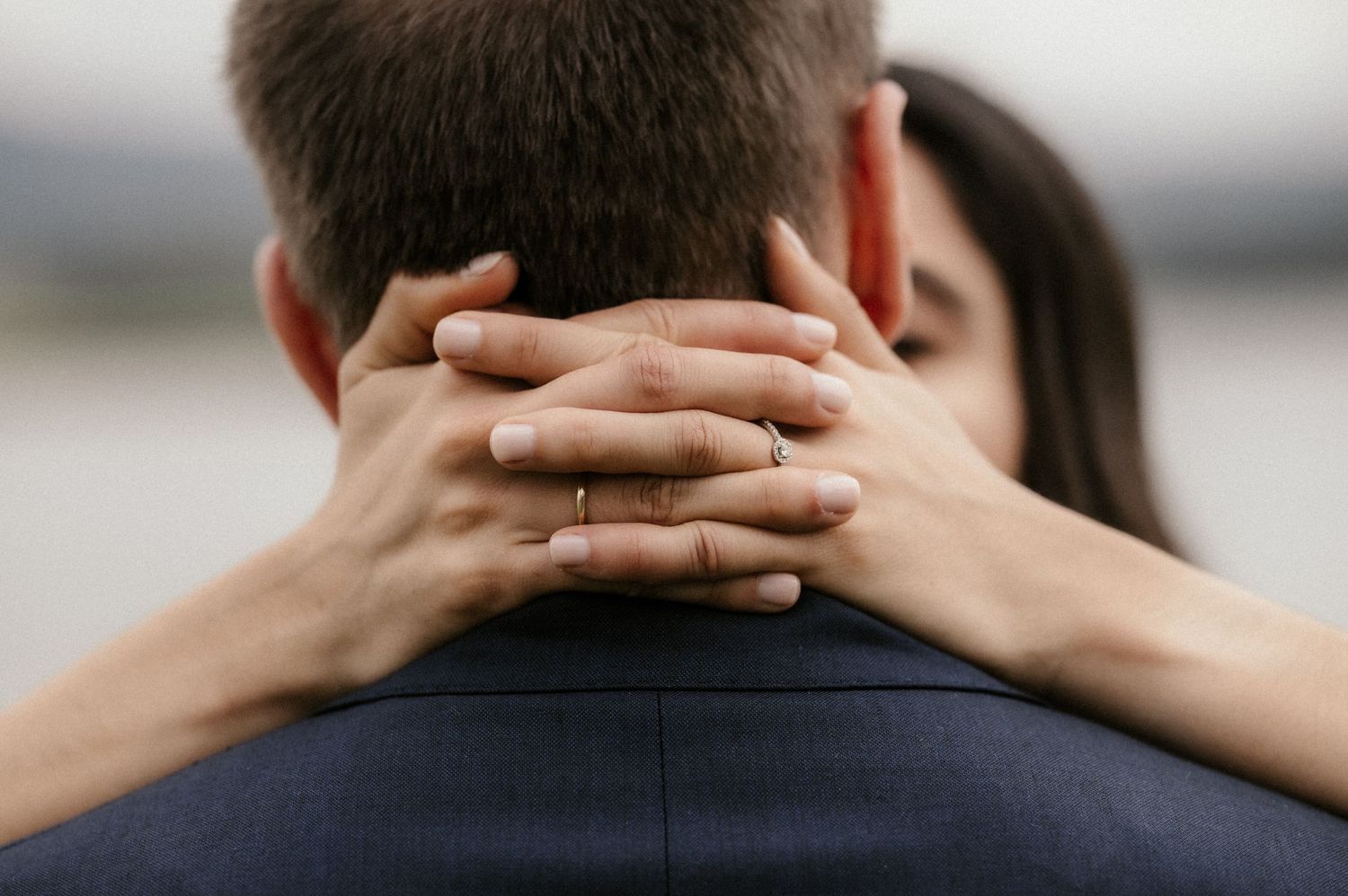 Two people embracing in a close romantic moment, shot in a series of intimate cropped frames.