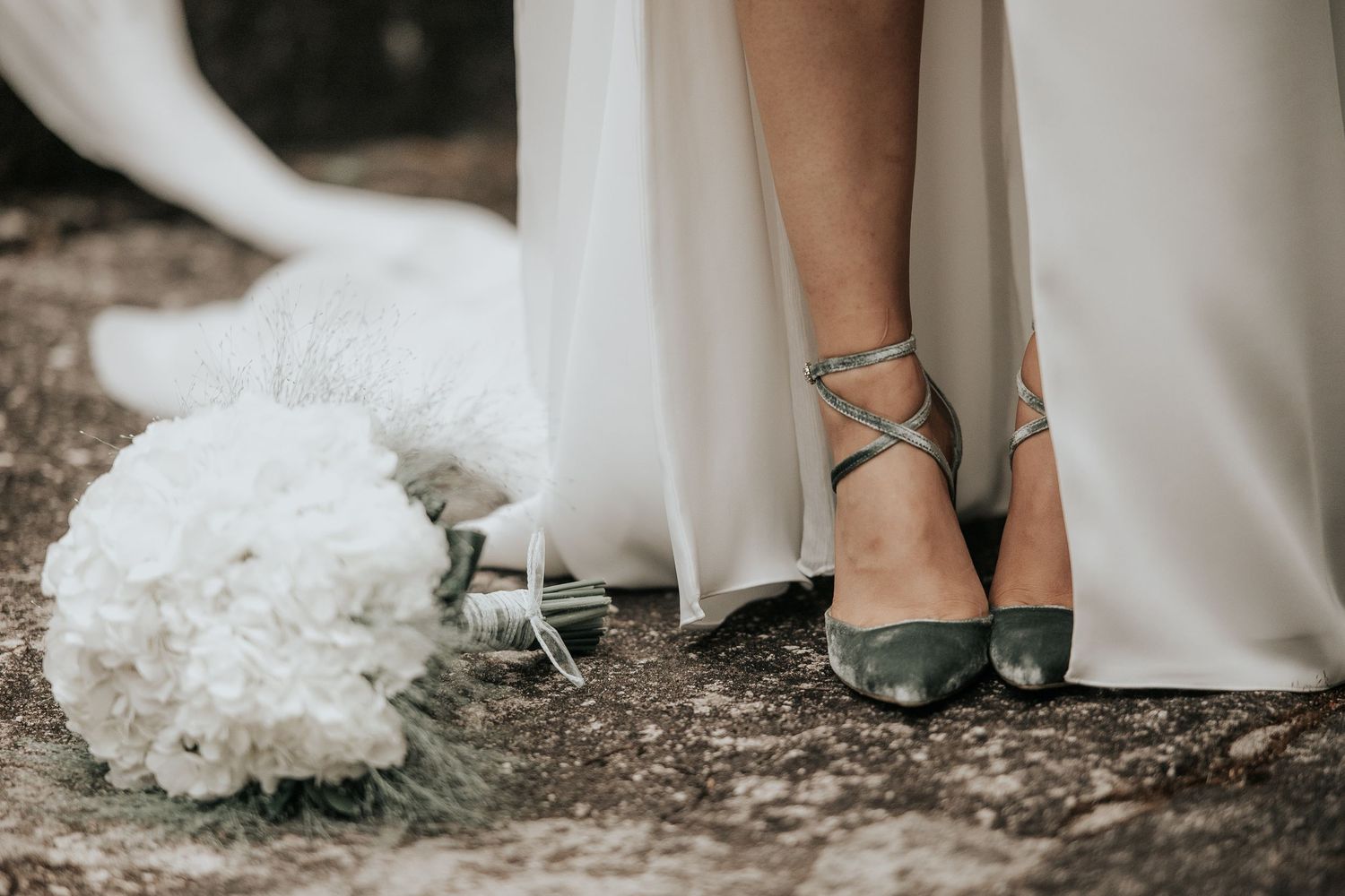 A row of wedding photos showing the bride's feet in sage green heels and white dress hem with white hydrangea bouquet.