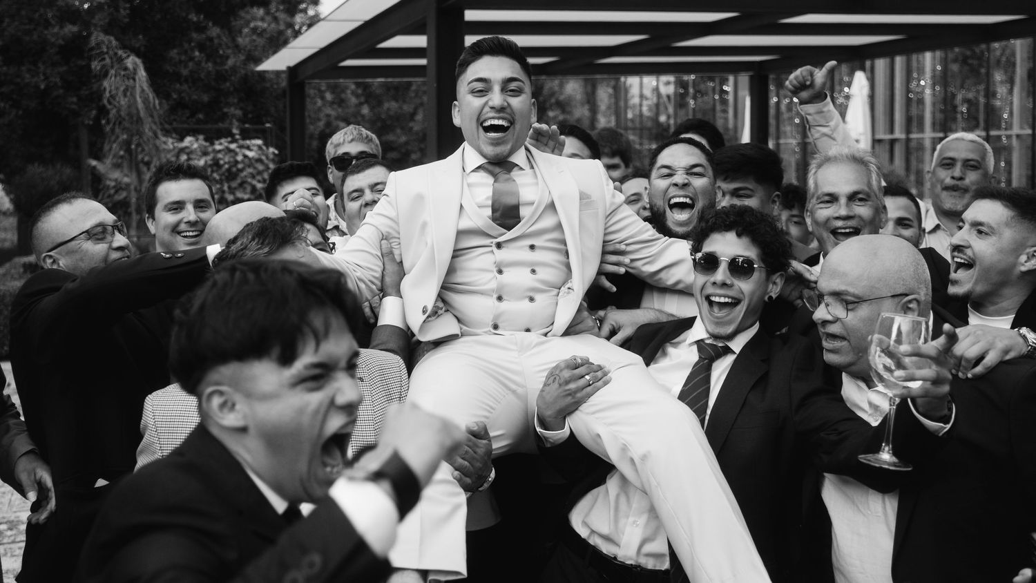 A black and white photo collage showing people in a crowd expressing various emotions and reactions.
