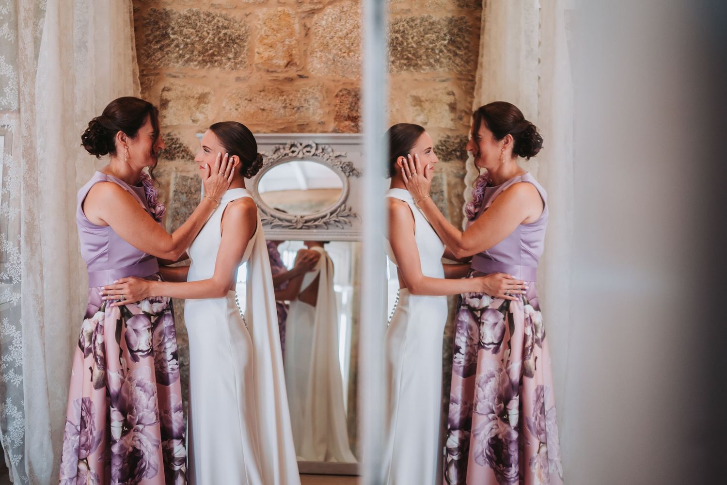 Wedding party in floral dresses helping with bridal preparations.