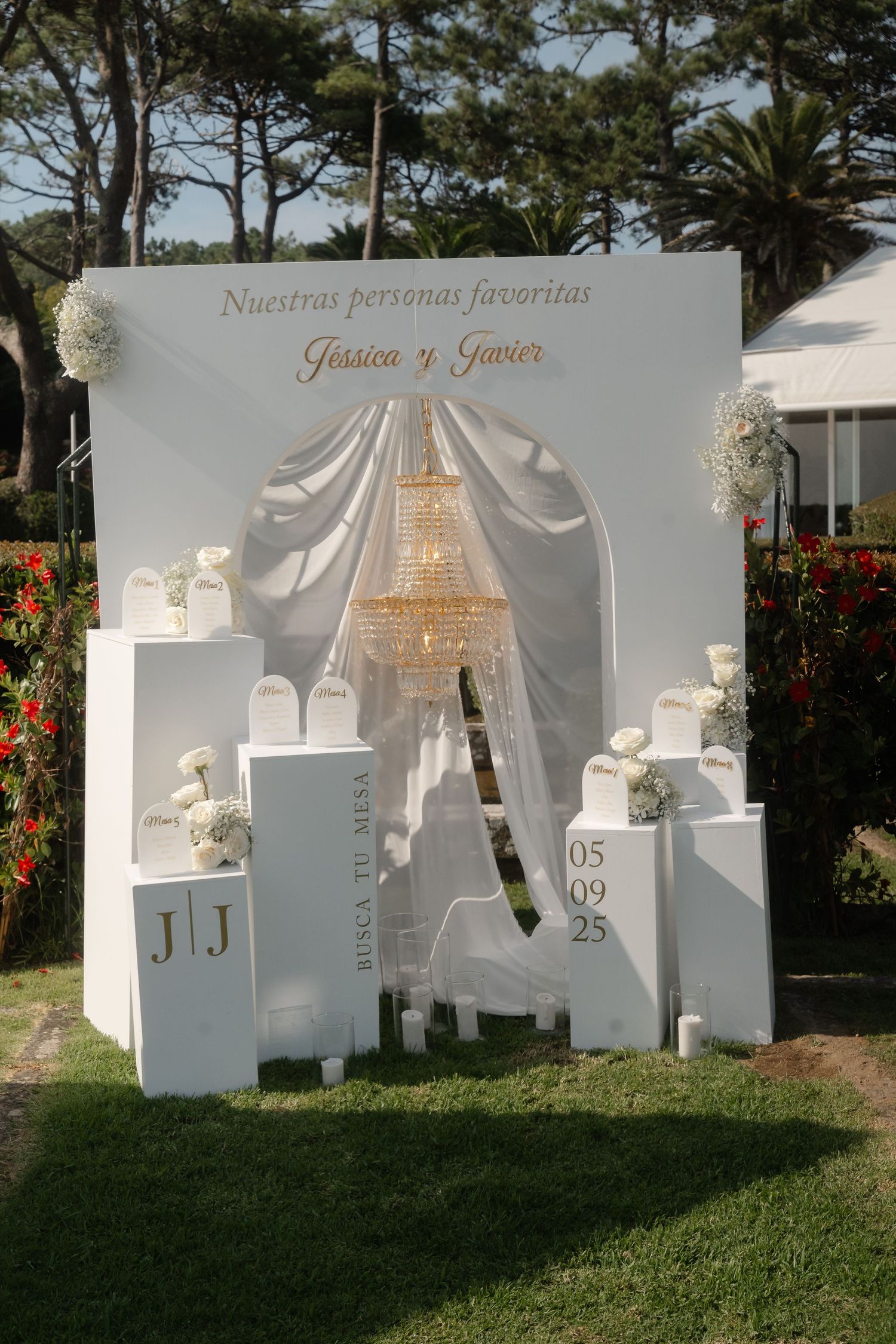 White decorative wall panels with silhouettes and text display for a wedding celebration.