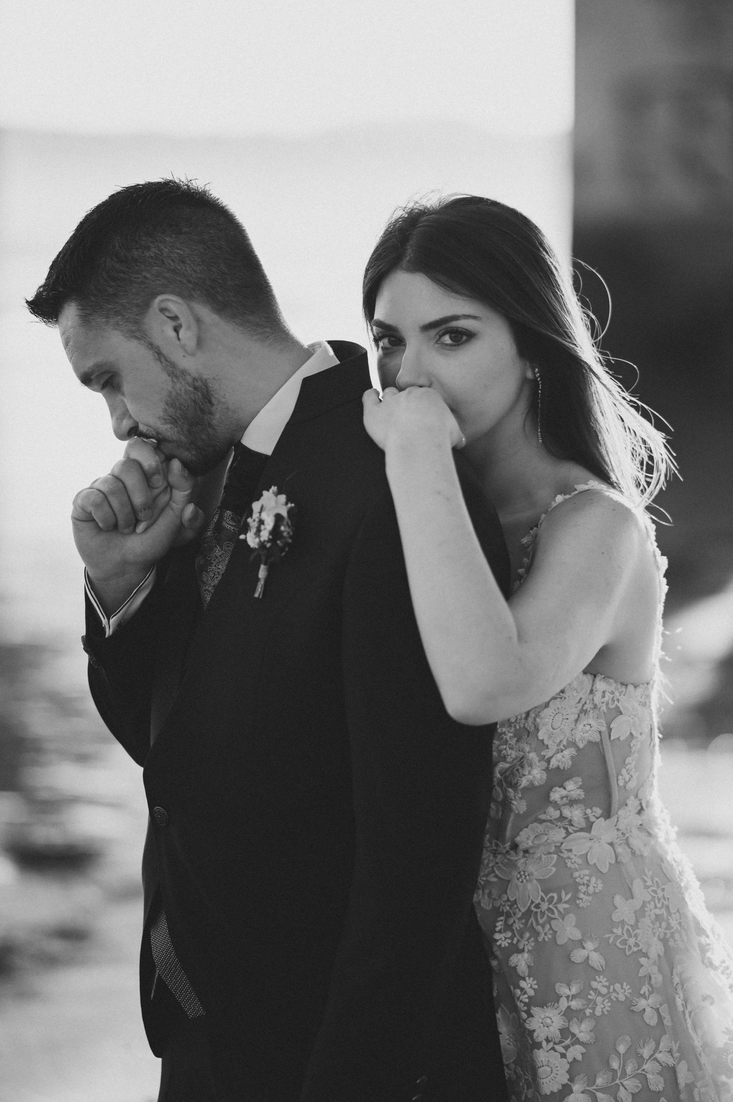 A series of intimate black and white wedding portraits showing tender moments between newlyweds.