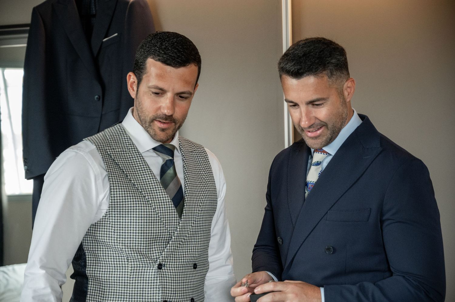 Business colleagues reviewing documents together in a modern office setting.