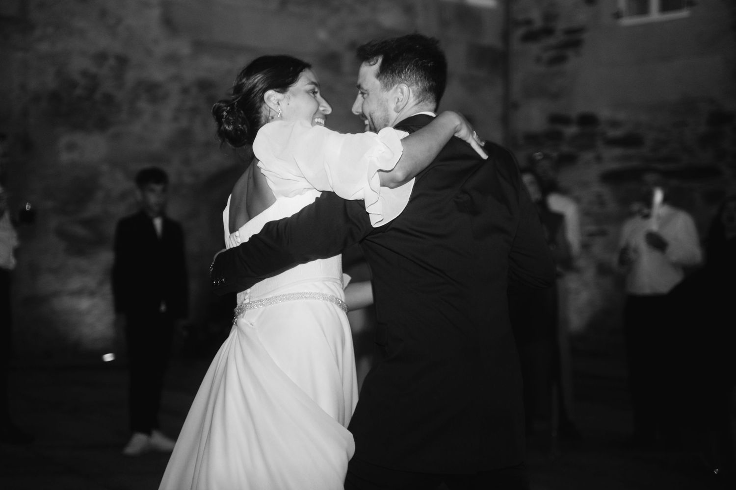 A series of black and white photos showing couples dancing at what appears to be a wedding reception or formal event.