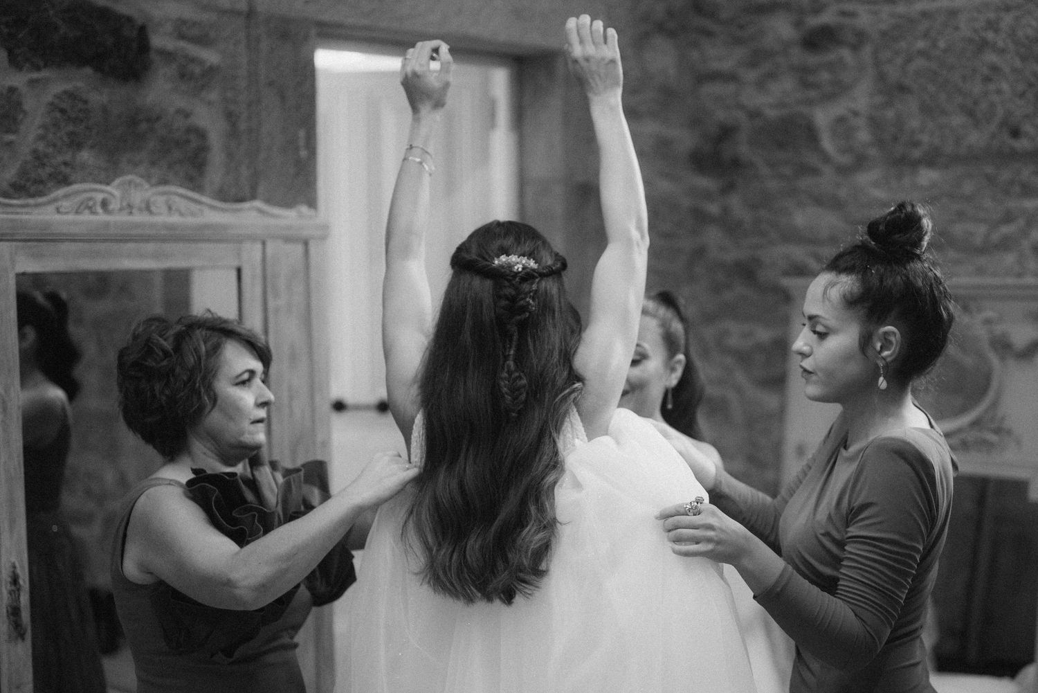 Black and white sequence capturing celebratory moments at a wedding event.