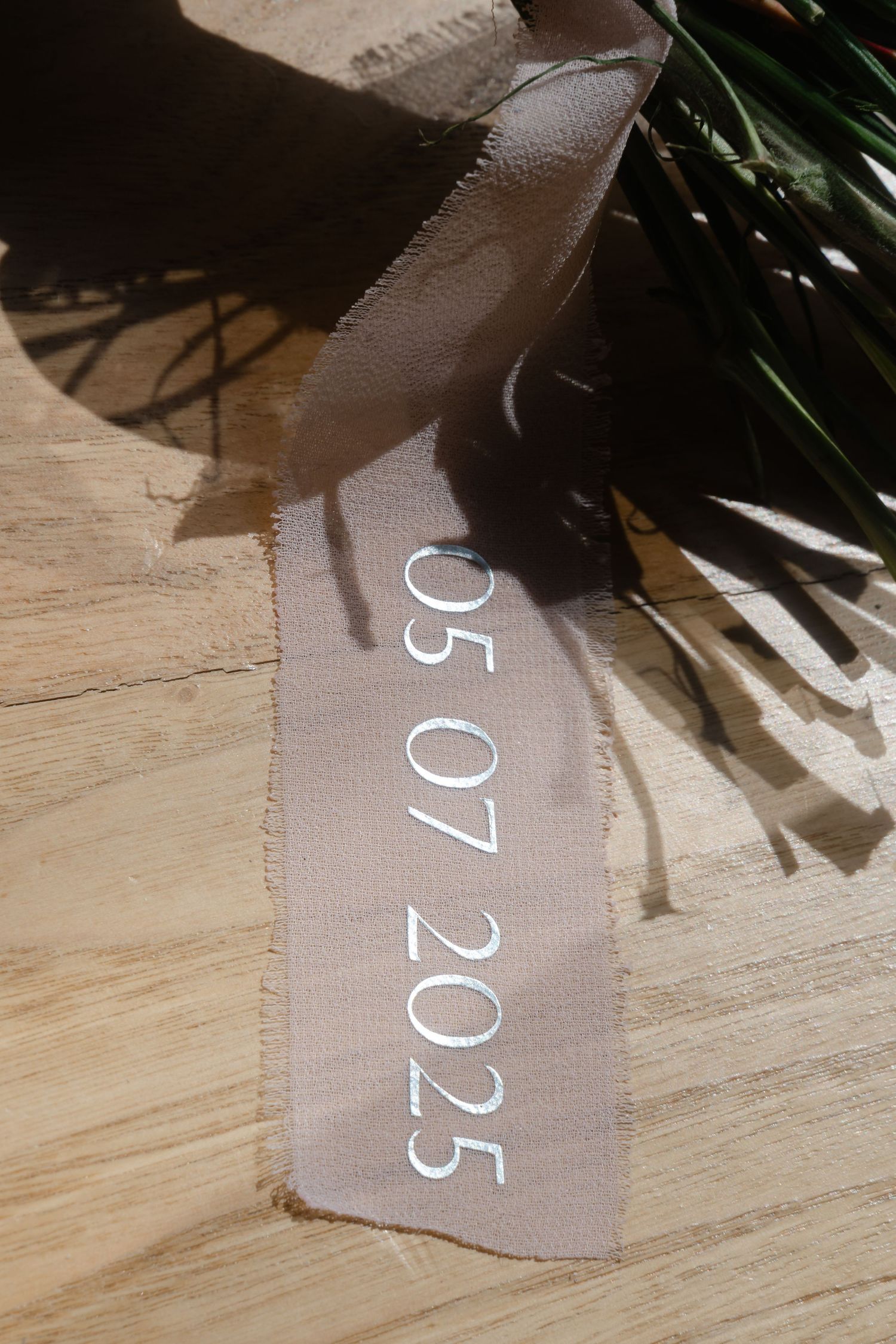 Wedding dress price tag with numbers visible in soft natural lighting.