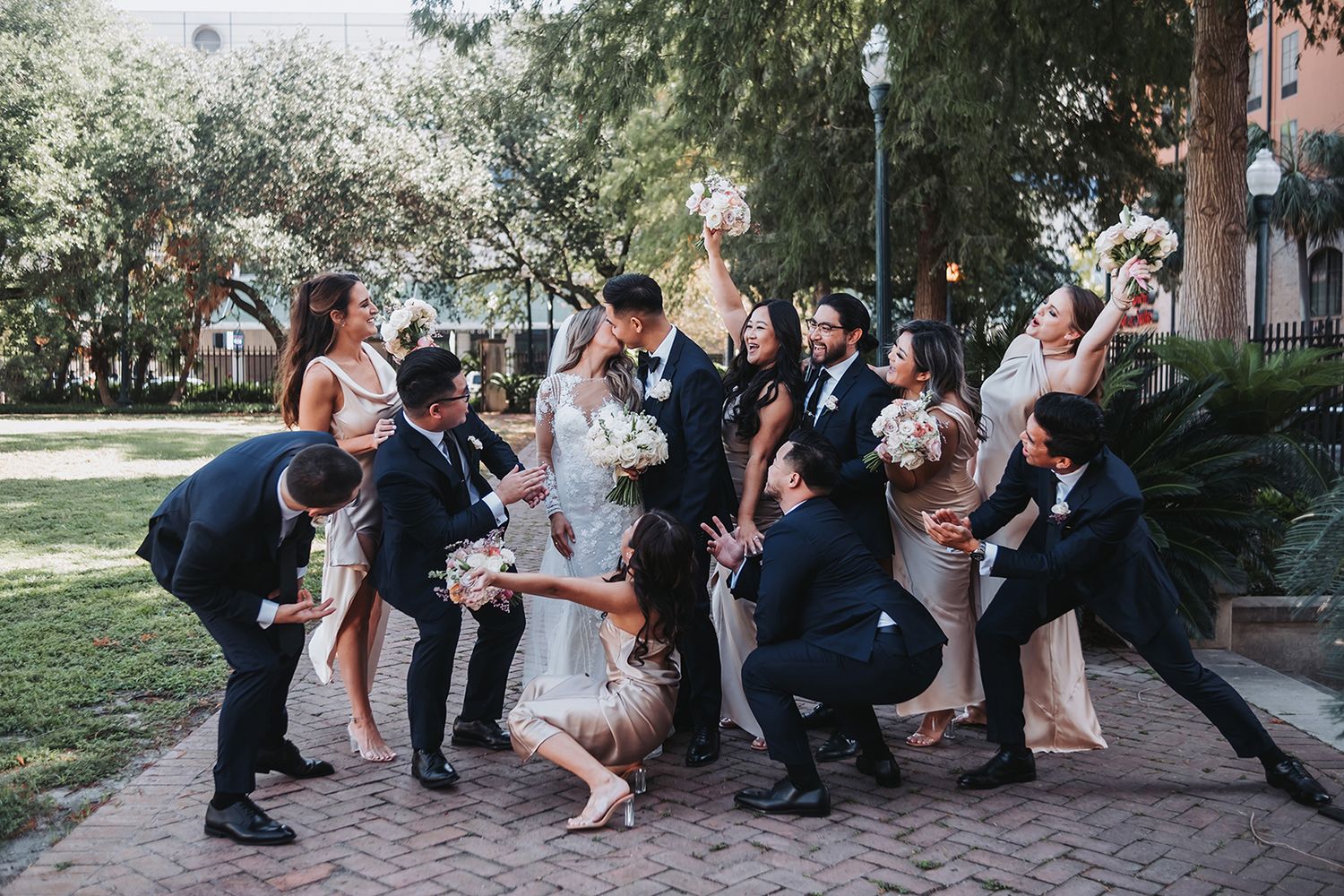 New Orleans wedding party photos with bridal party, bridesmaids, and groomsmen captured in candid and classic group portraits