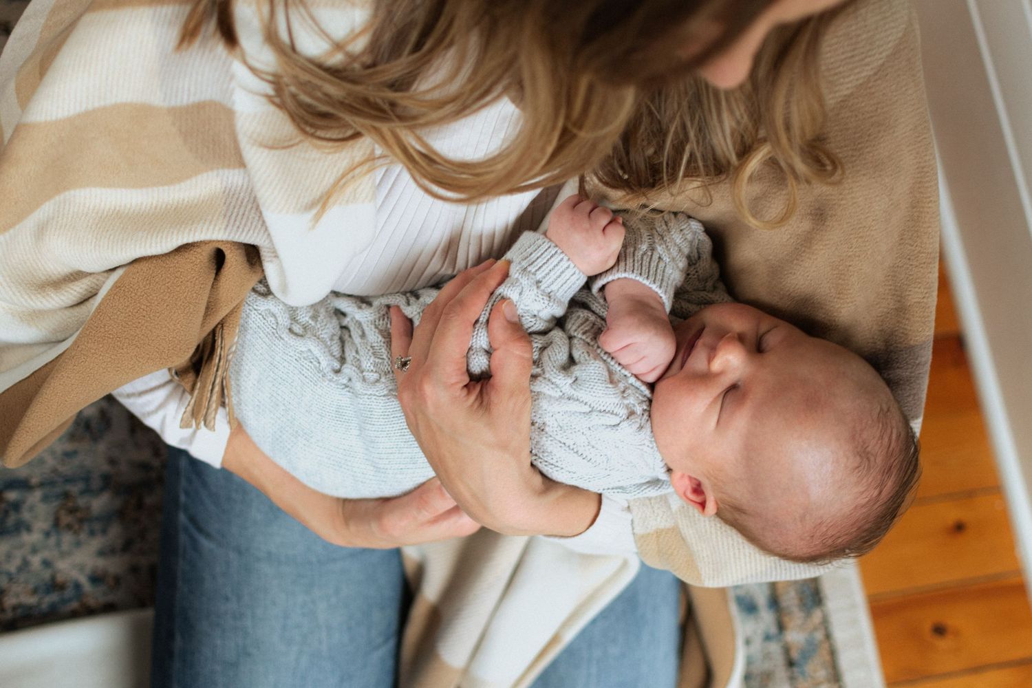 Wausau, Eau Claire, Green Bay, Wisconsin Wedding | Family | Newborn Photography. Newborn in mother's arms. Sweet moment.