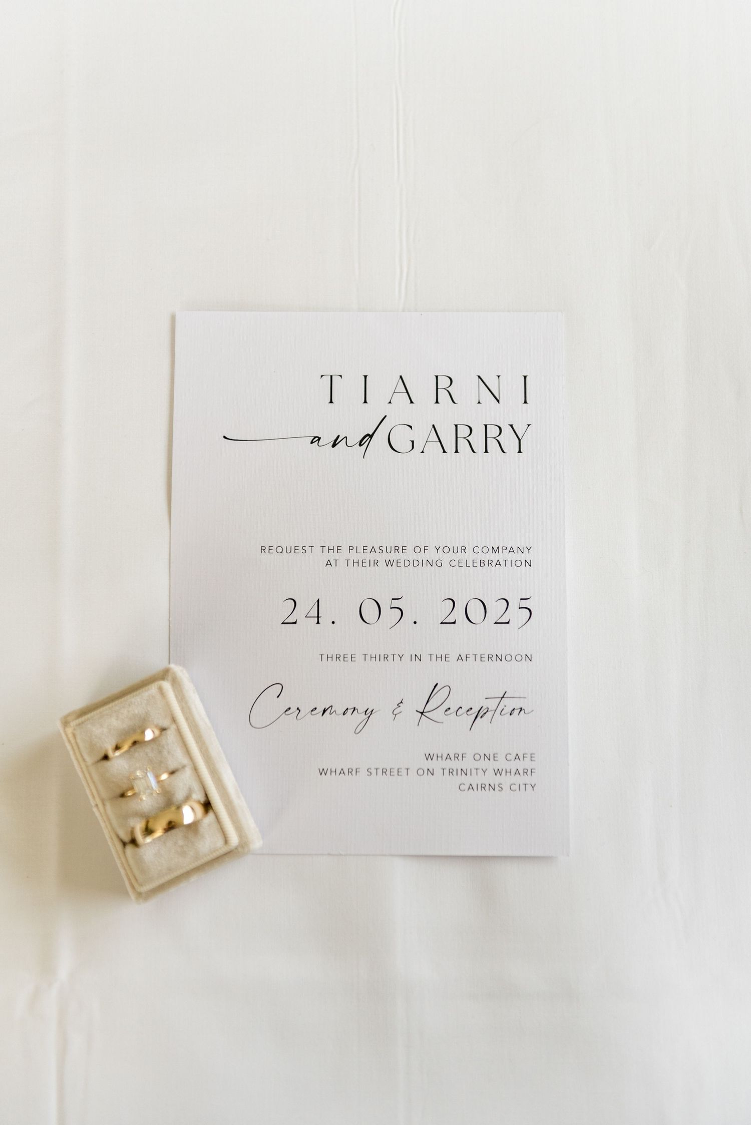 Elegant minimalist wedding invitation for Tiarni and Garry dated 24.05.2025 at Wharf One Cafe, Cairns City.