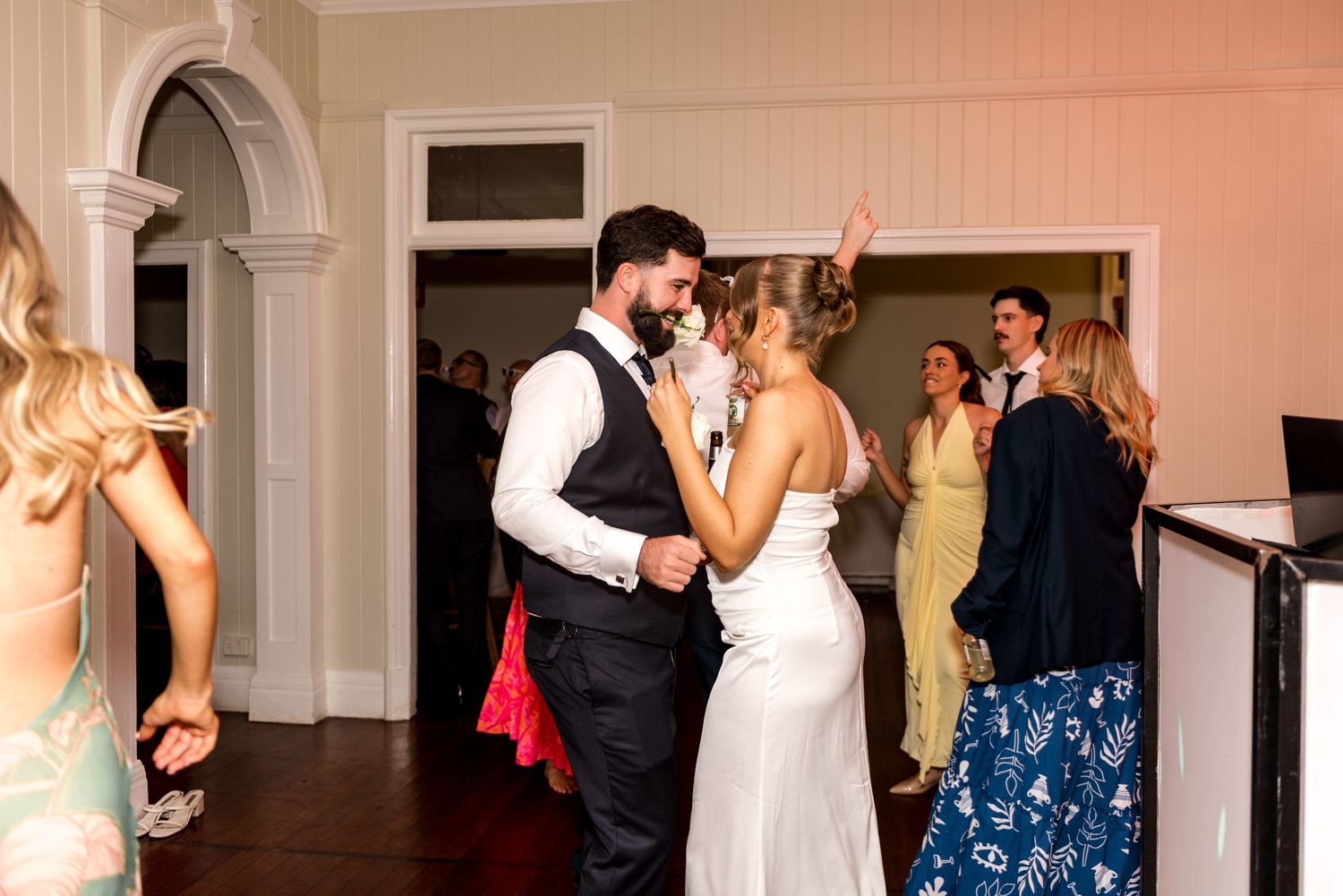 Bride and groom sharing a romantic dance together at their wedding reception.