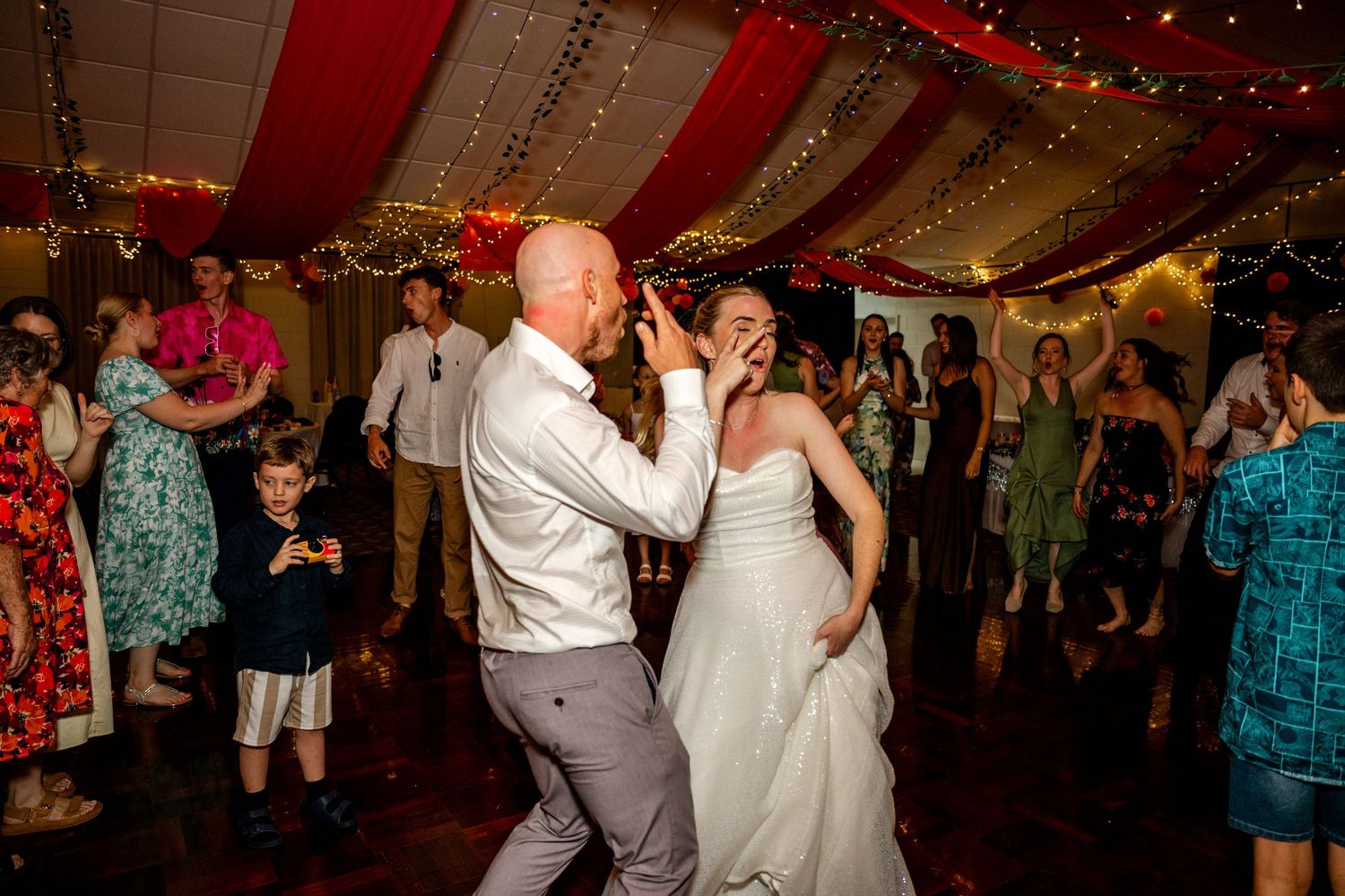Bride and groom sharing a dance together at their wedding reception.