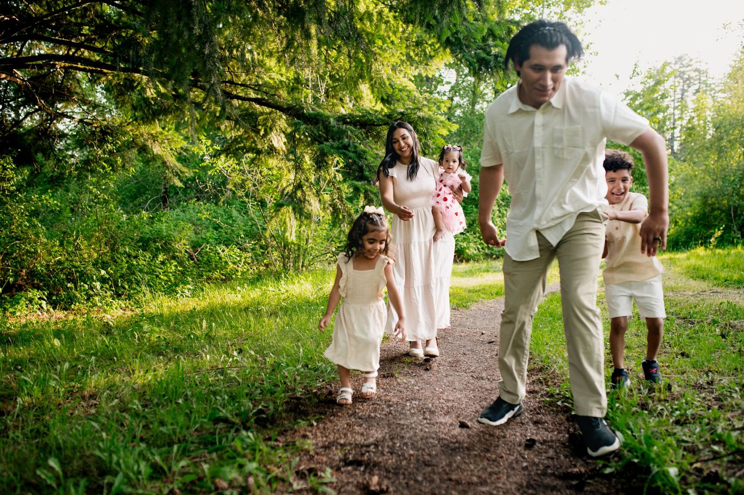 Candid family photos of kids playing and having fun with their parents in Camas, WA. Lifestyle family photographer in Vancouver areas.