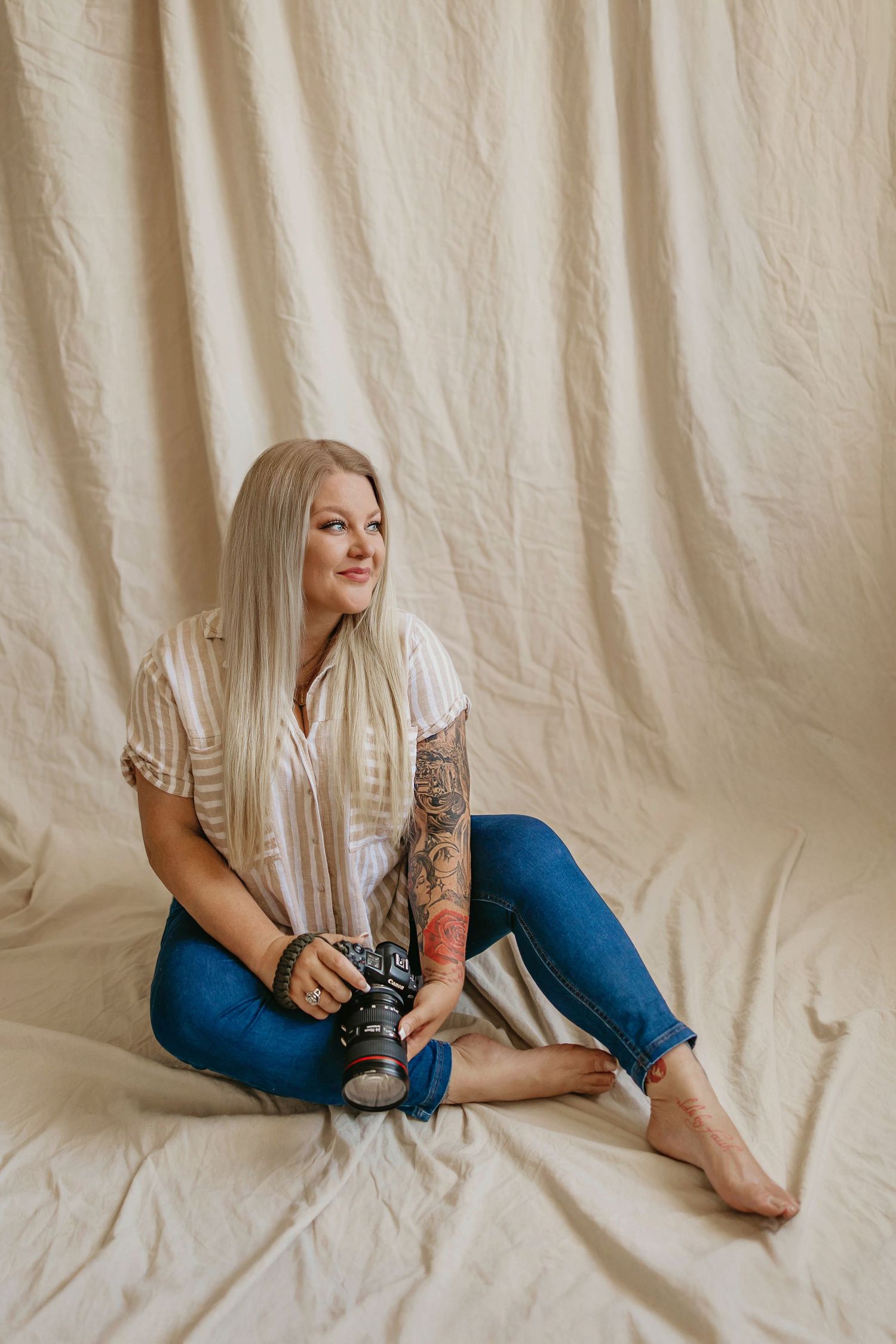 A series of minimalist fashion photos showing someone in jeans and white shirt reclining against a beige backdrop.