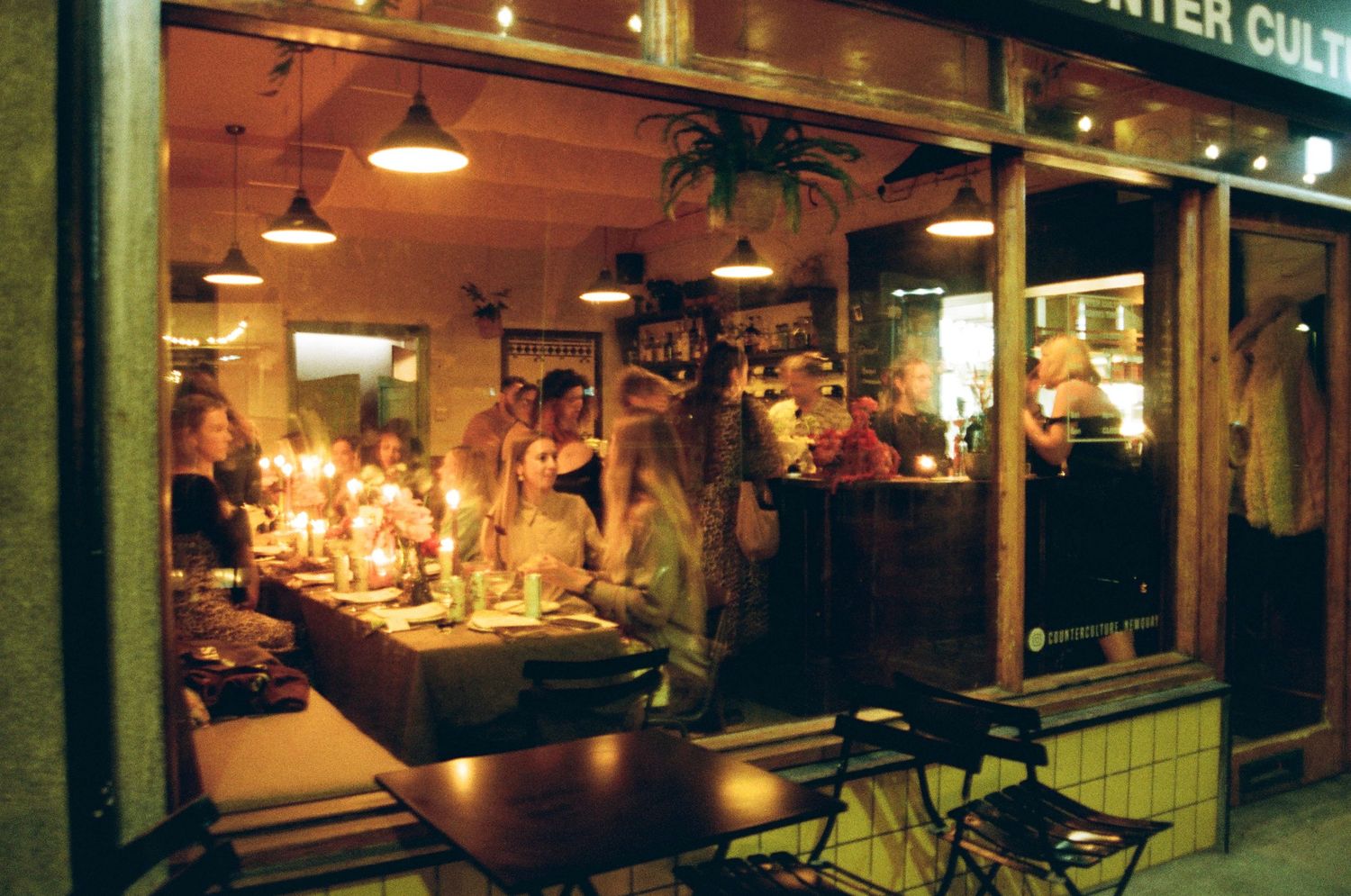 Dimly lit restaurant interior with warm ambient lighting and modern decor.