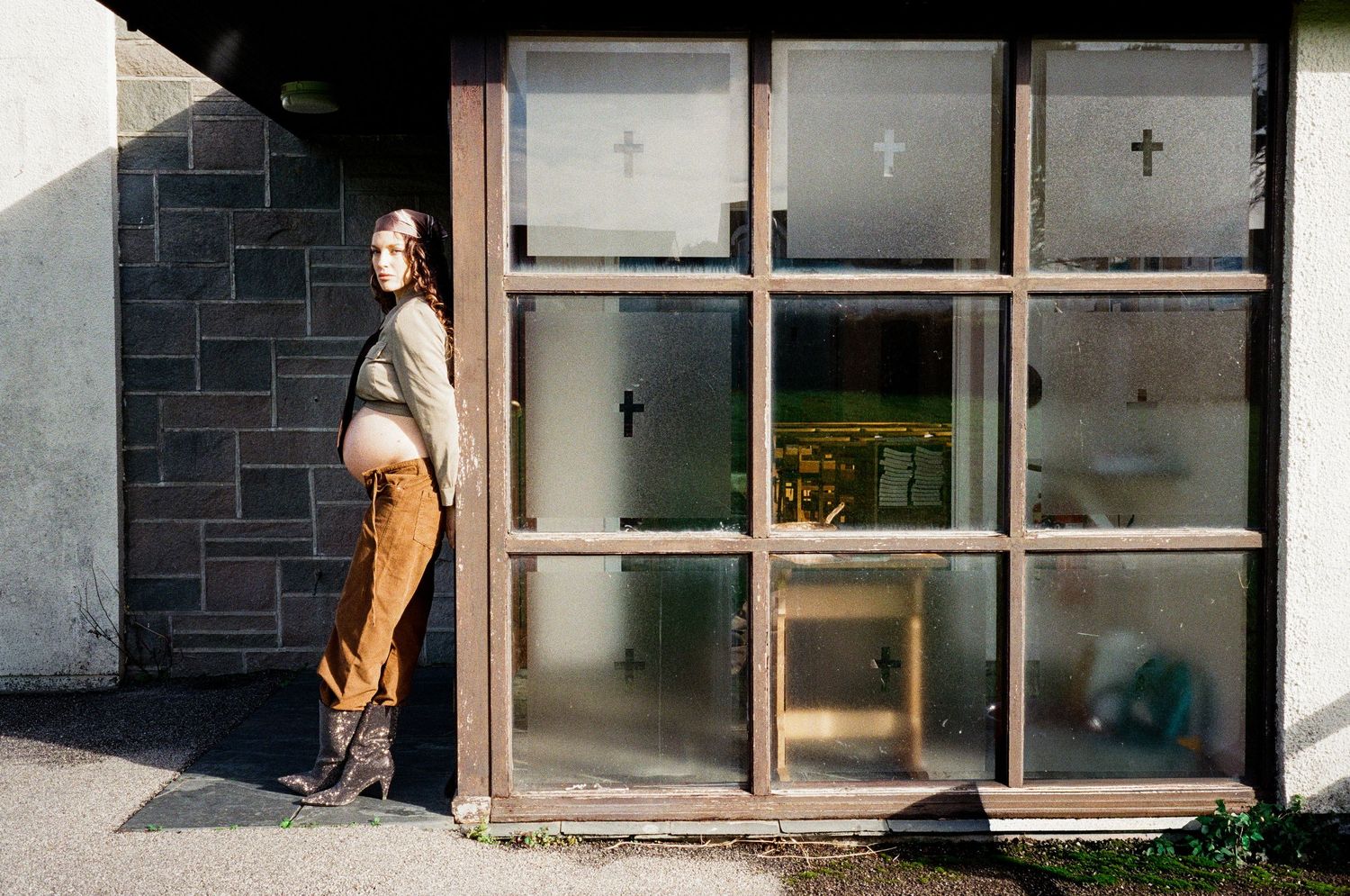 Series of architectural shots showing someone interacting with a window frame in natural light.