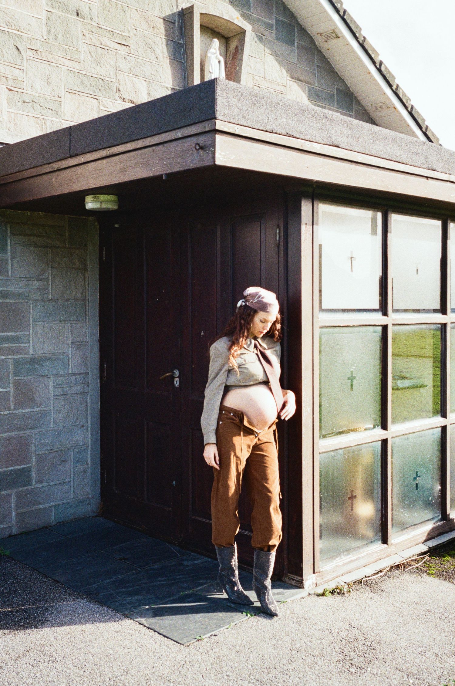 Playful sequence showing someone peeking and hiding behind a door in an industrial setting.