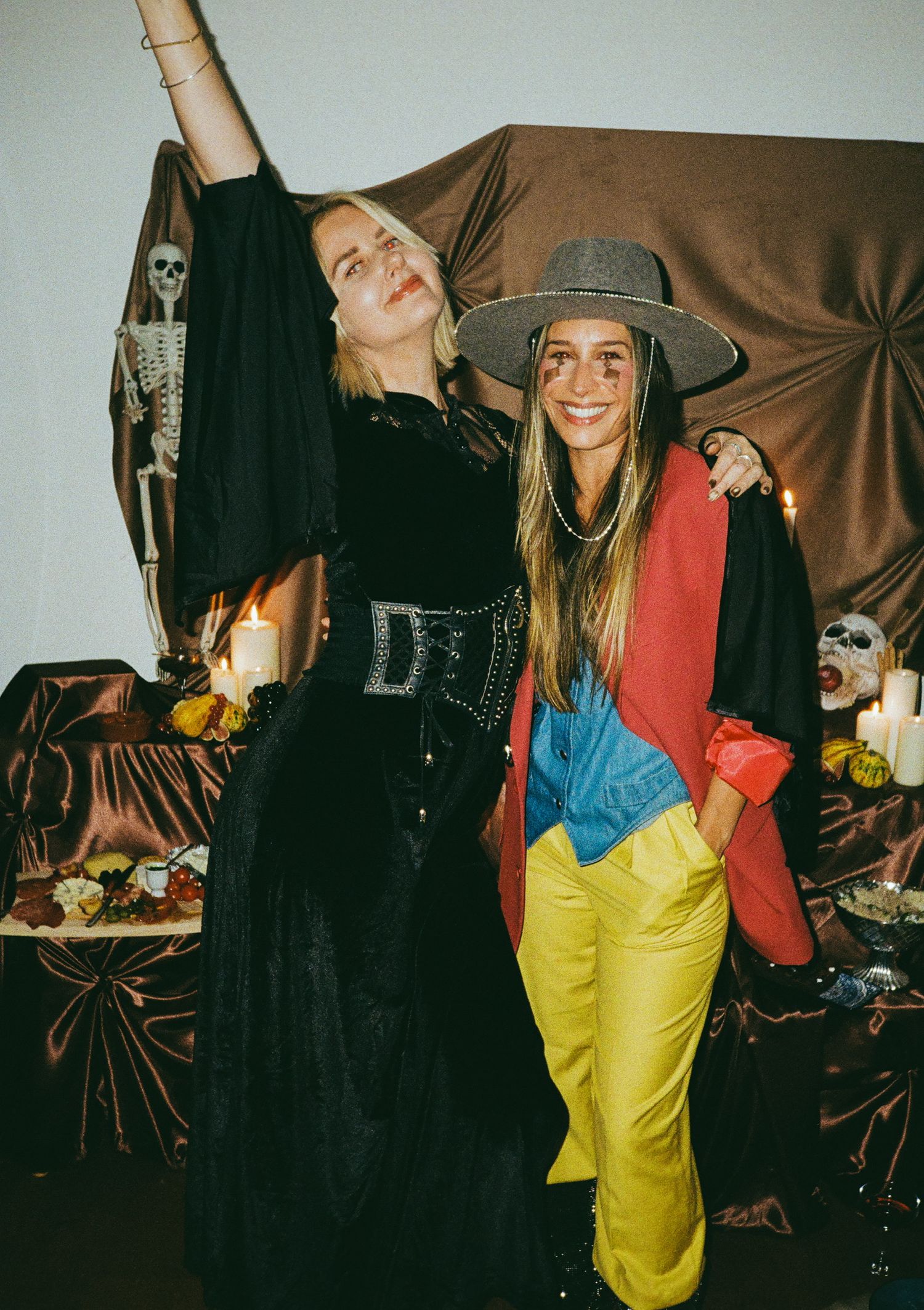 Partygoers in casual attire enjoying a relaxed indoor gathering.