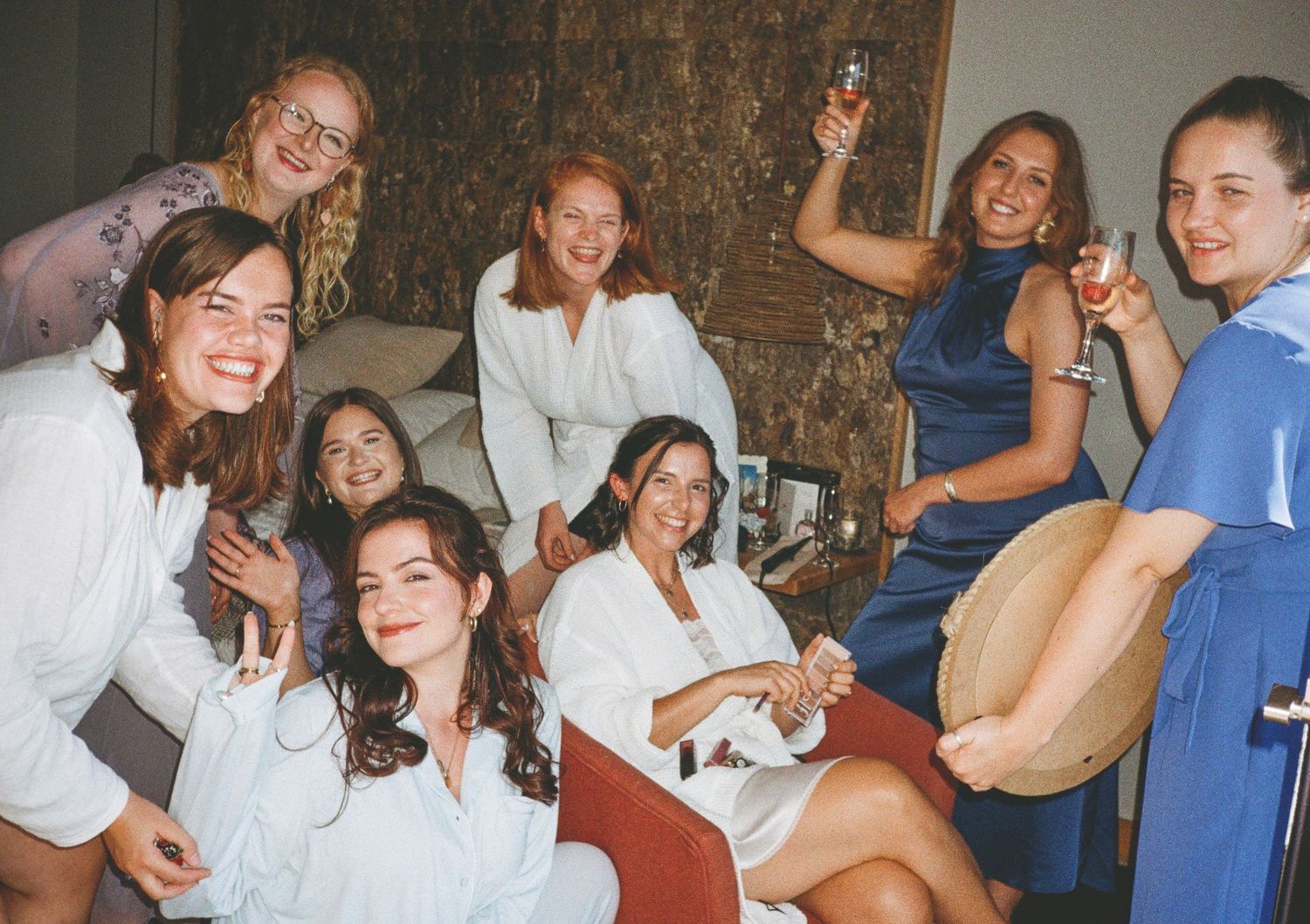 Group of friends laughing and socializing at a casual gathering.