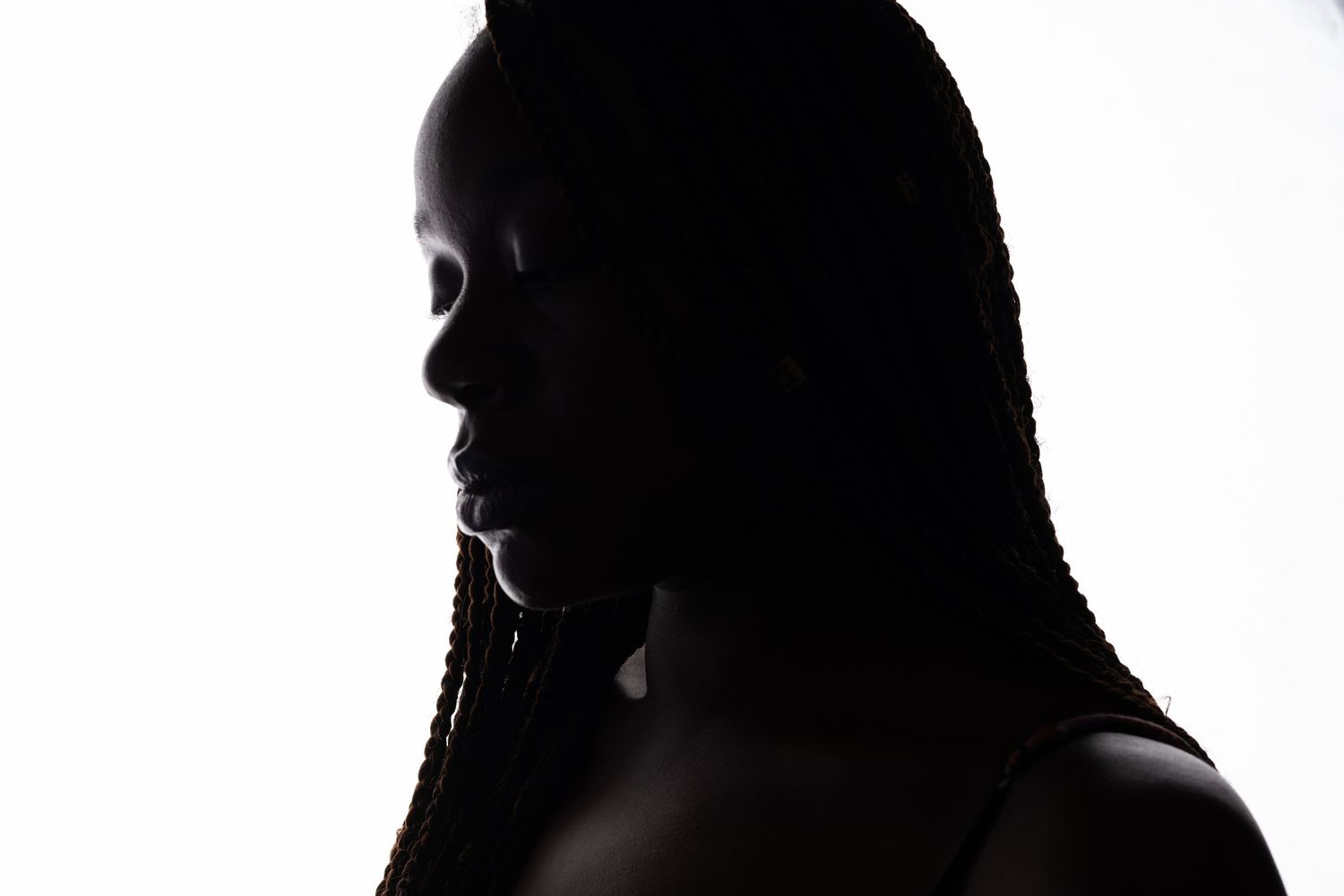 Dramatic silhouette portraits showing various angles against bright background.