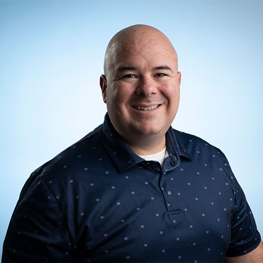 Portrait series showing different expressions against a blue backdrop.