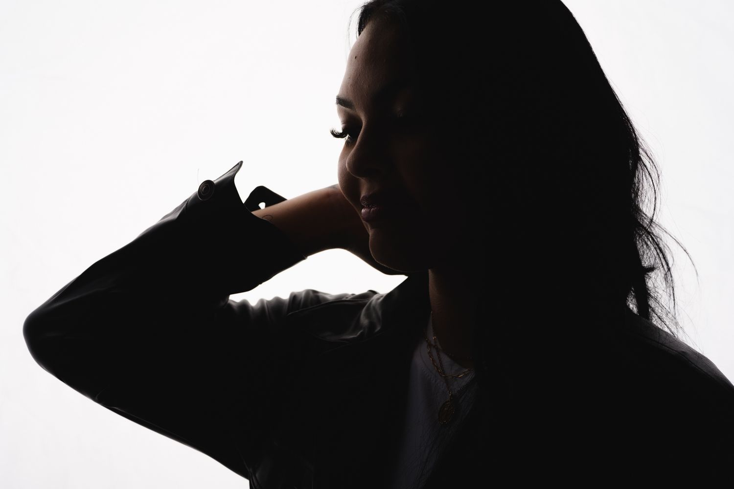 Artistic silhouette portraits showing dramatic poses and movement against white background.