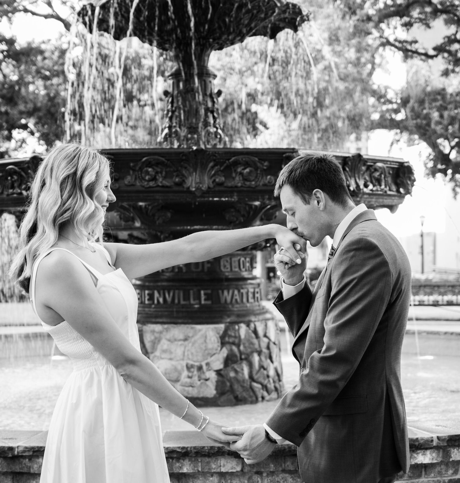 Romantic first dance sequence in black and white under a willow tree.