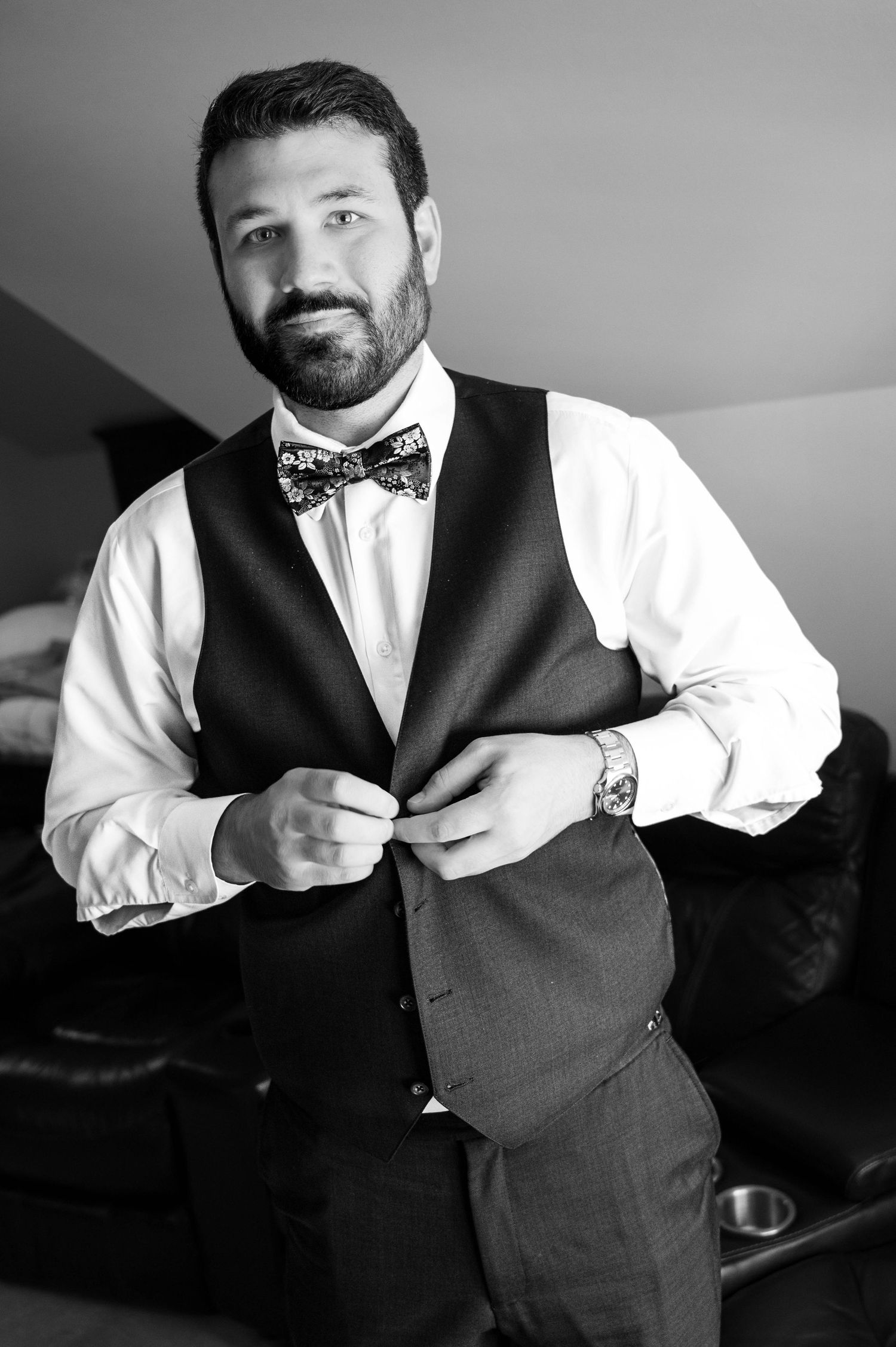 Getting ready sequence showing formal attire and bow tie adjustments.