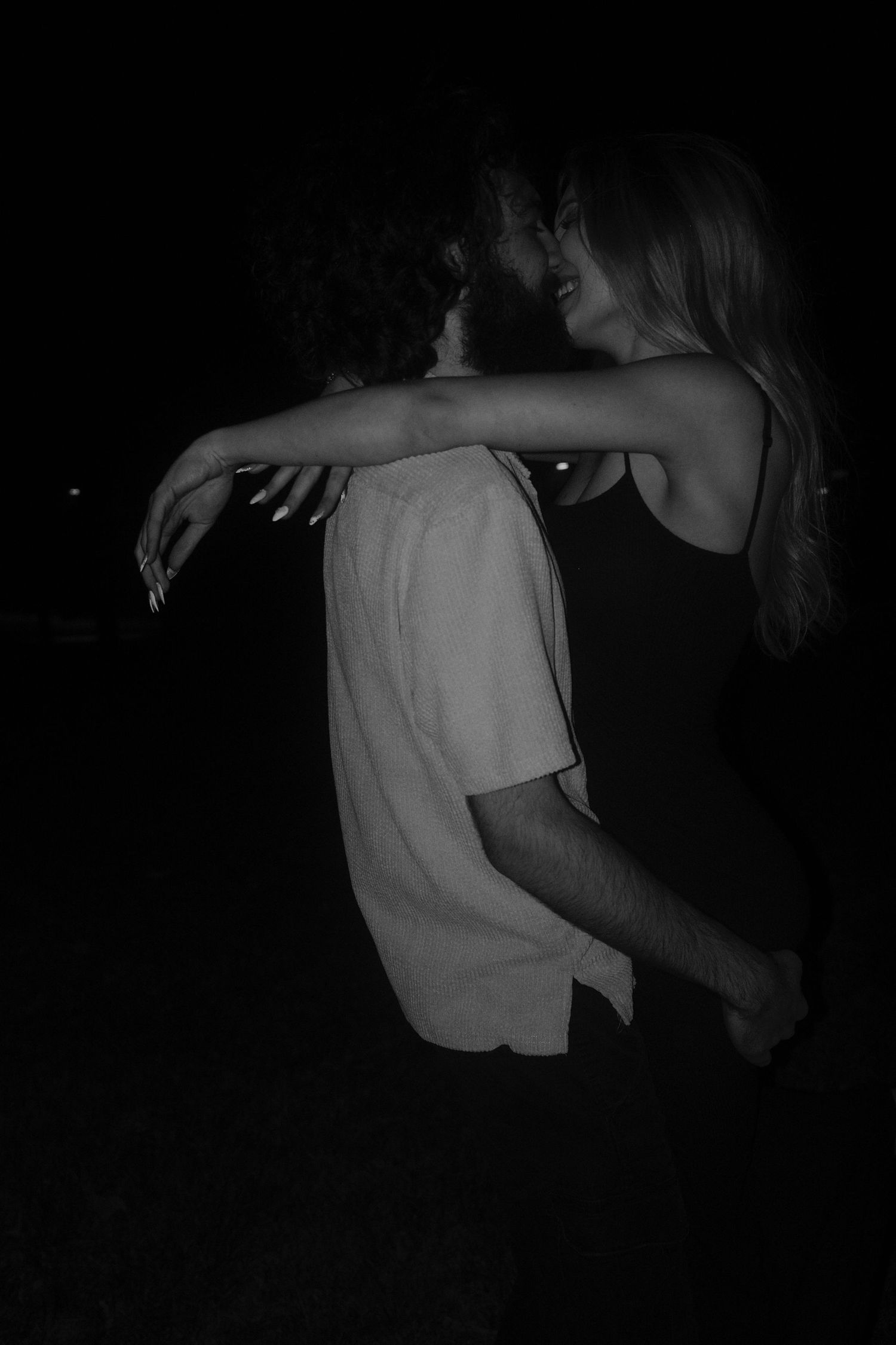 A series of dark monochromatic images showing silhouettes of people dancing in dim lighting.