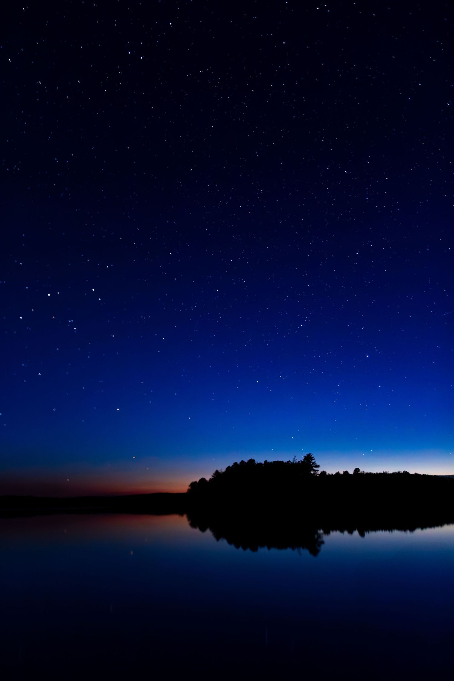 A starry sky over a lake in Northern Minnesota.