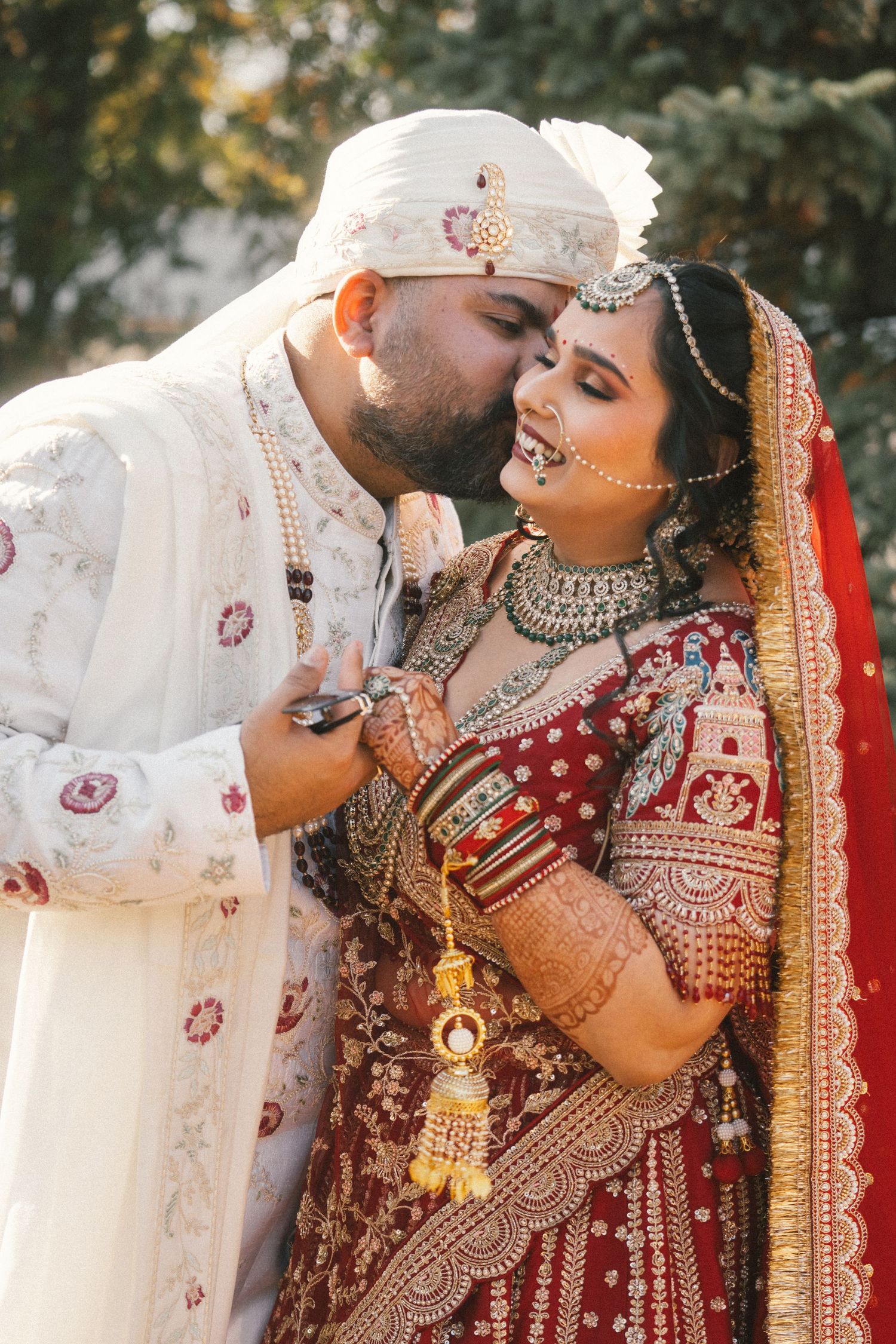 Romantic moment captured during traditional Indian wedding ceremony.