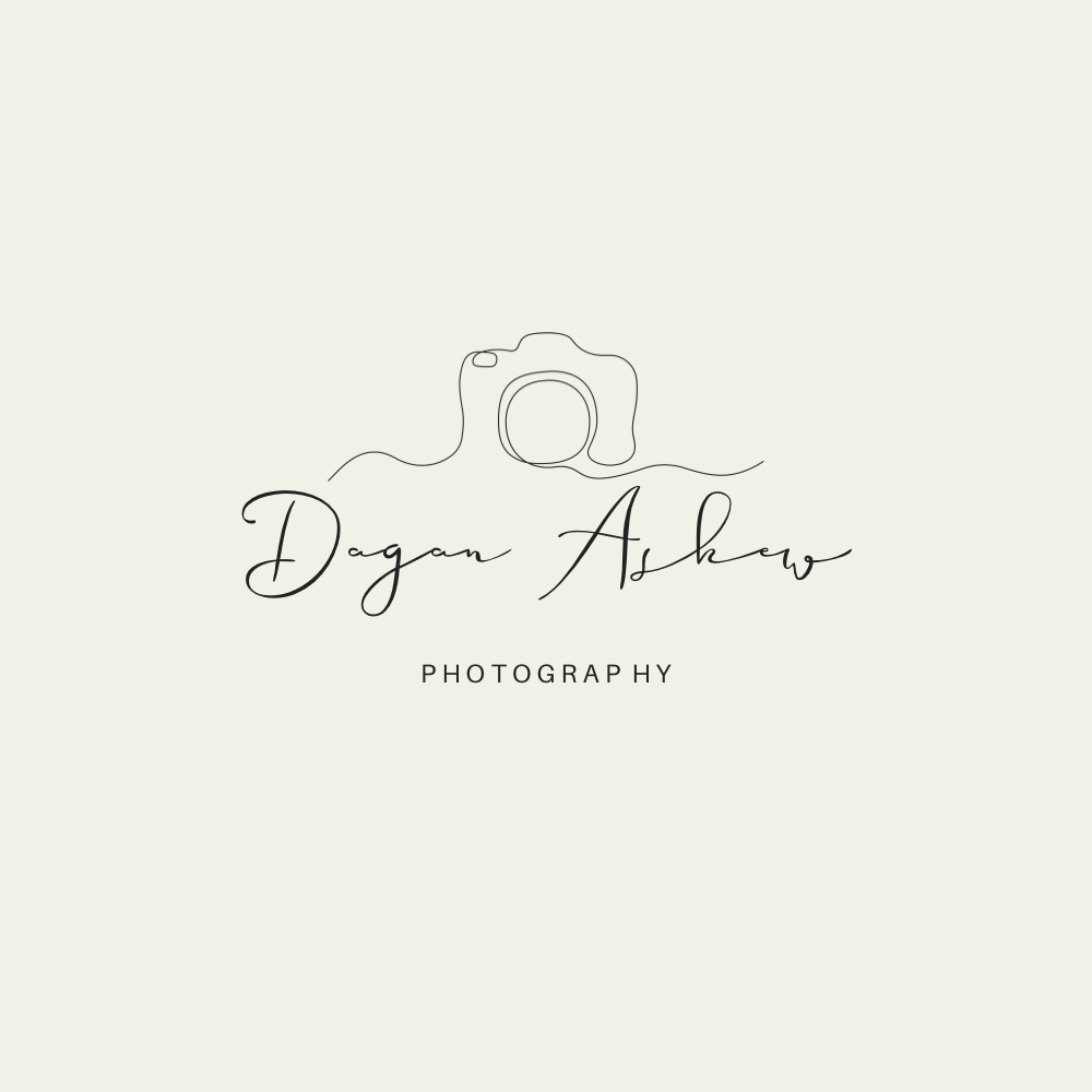 Minimalist photography logo design with camera and signature elements on light background.