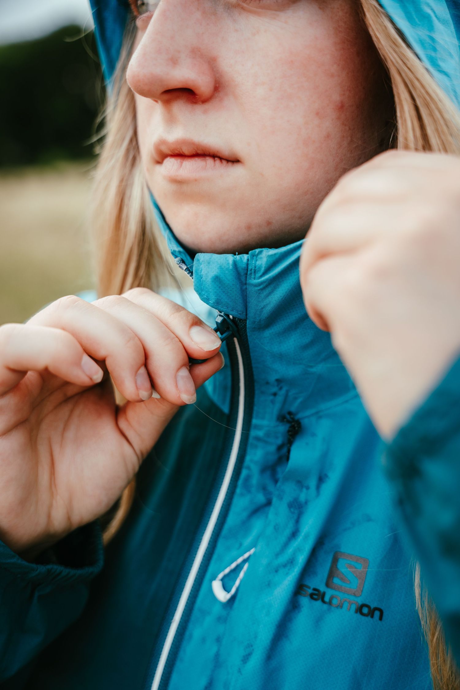 A sequence of close-up shots showing someone in a blue jacket drinking from a metal straw.