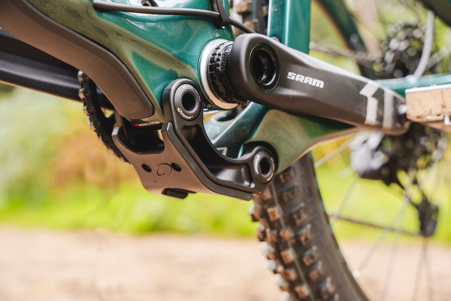 Close-up view of a bicycle derailleur and gear mechanism showing mechanical components and chain details.