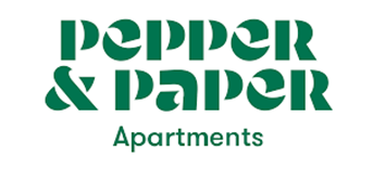 A modern apartment building logo design featuring the text 'pepper & paper' in green and black lettering.