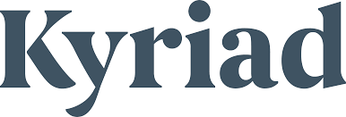 A close-up view of a large blue text logo with partial lettering visible against a white background.