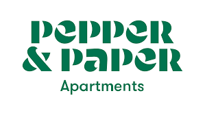A modern green and white apartment building logo design featuring text and a minimalist architectural element.