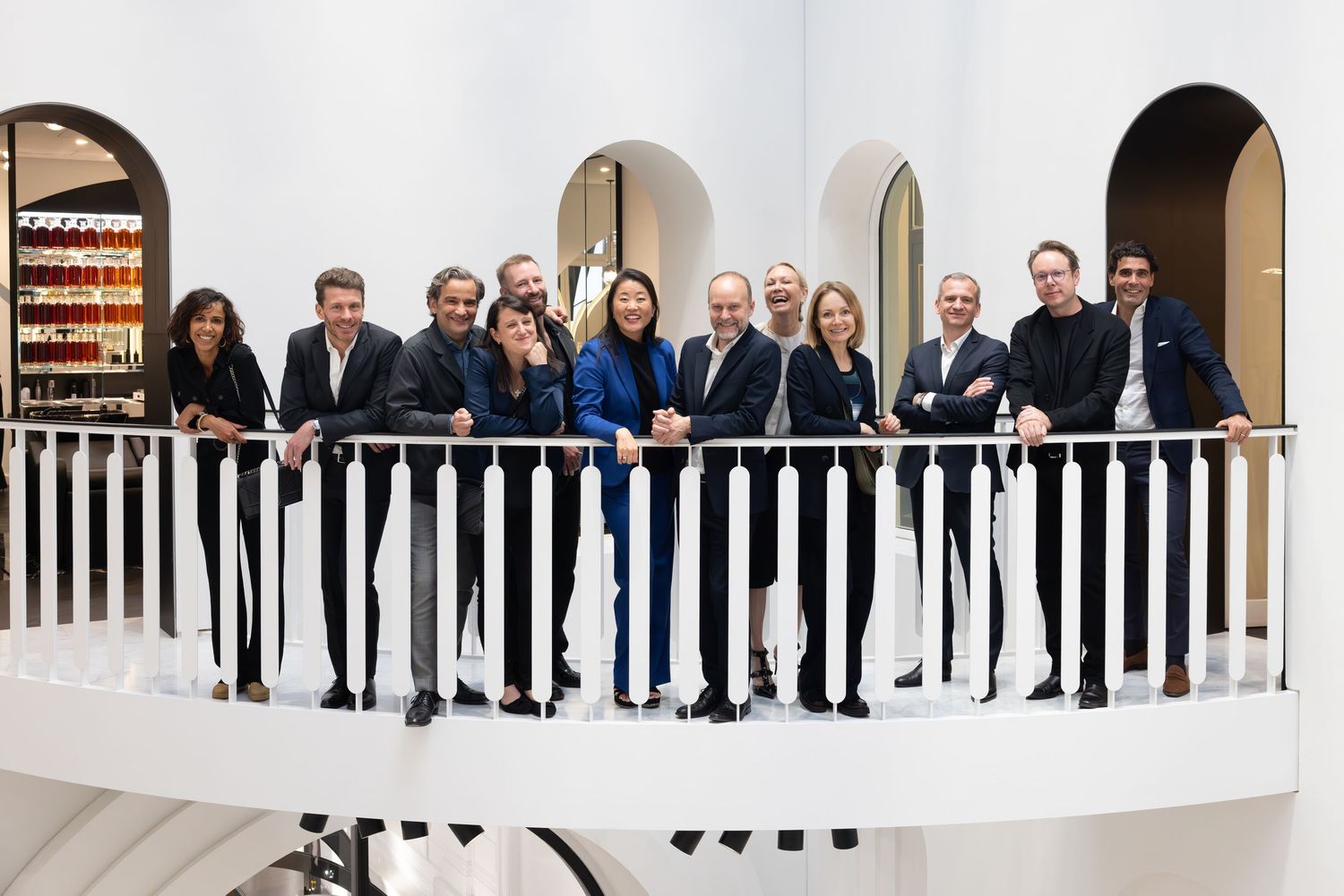 A creative composite photo showing a row of people's legs and feet arranged to look like piano keys against a white background.