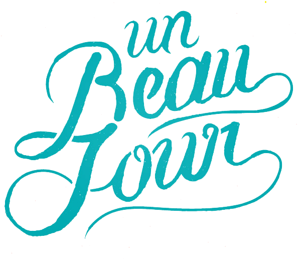 Stylish teal script typography reading 'un beau jour' against black background.