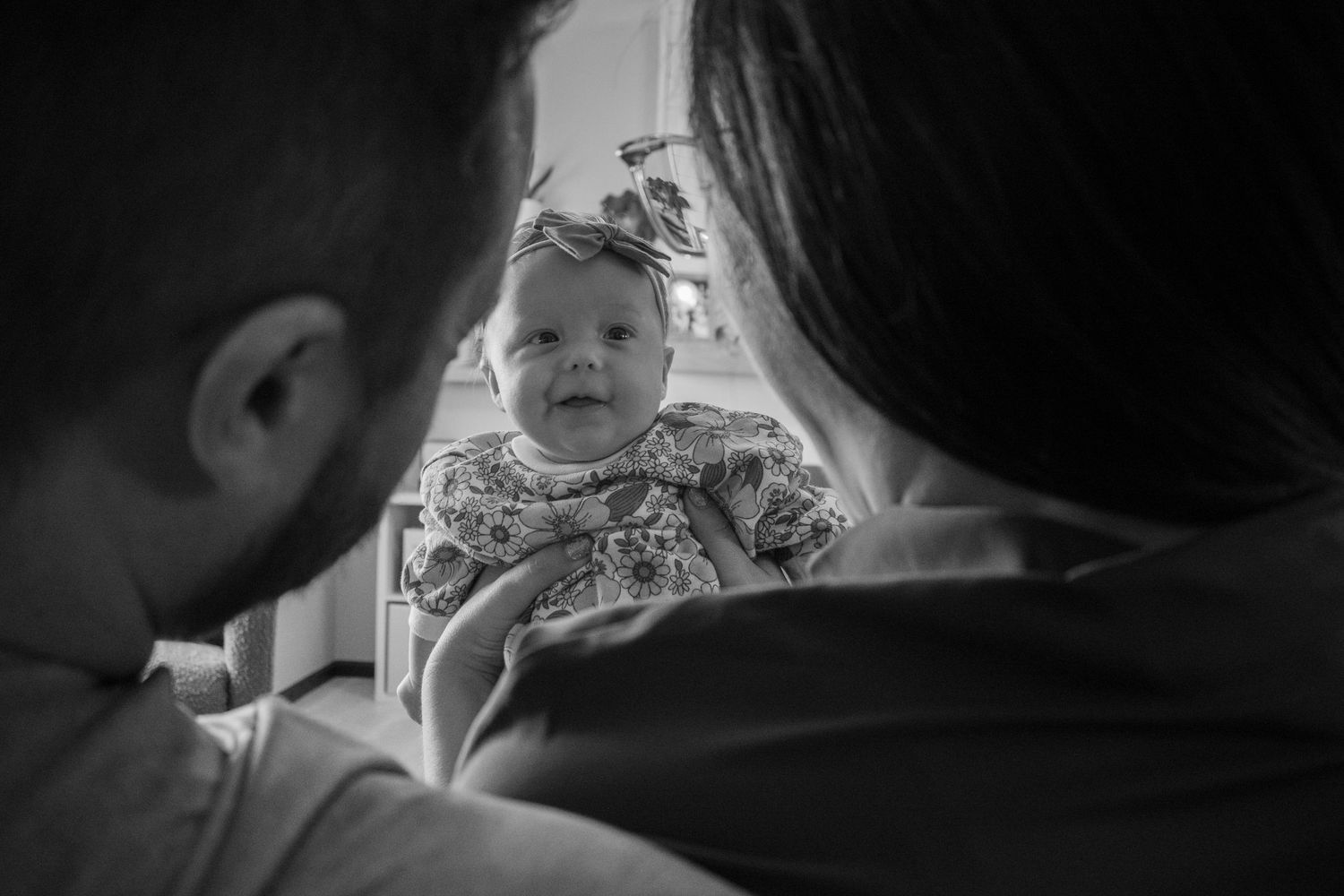 Close-up black and white portrait showing joyful expressions.