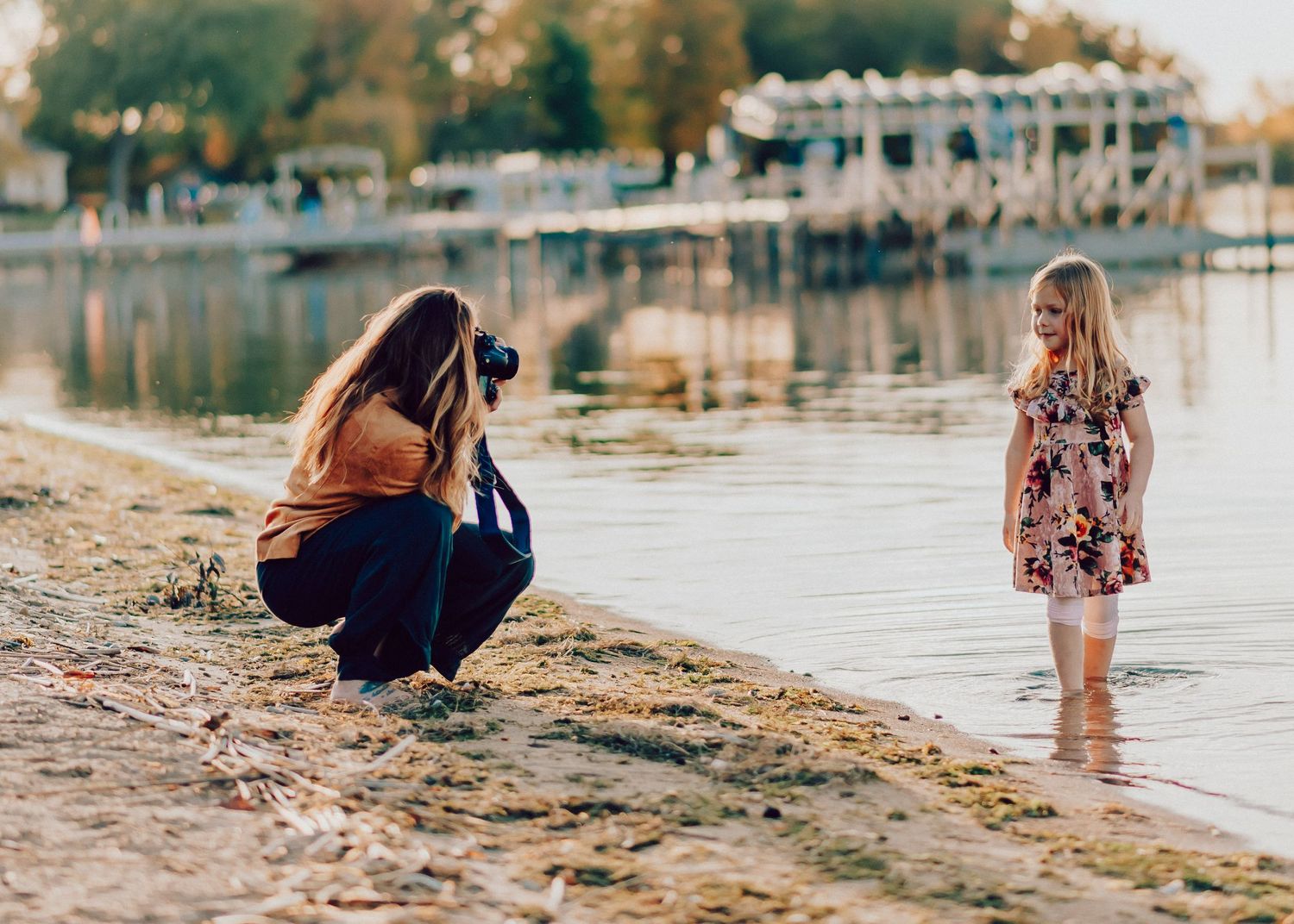 Whitney Wells taking a family photo of her daughter at a beach in Lake Mills, Wisconsin