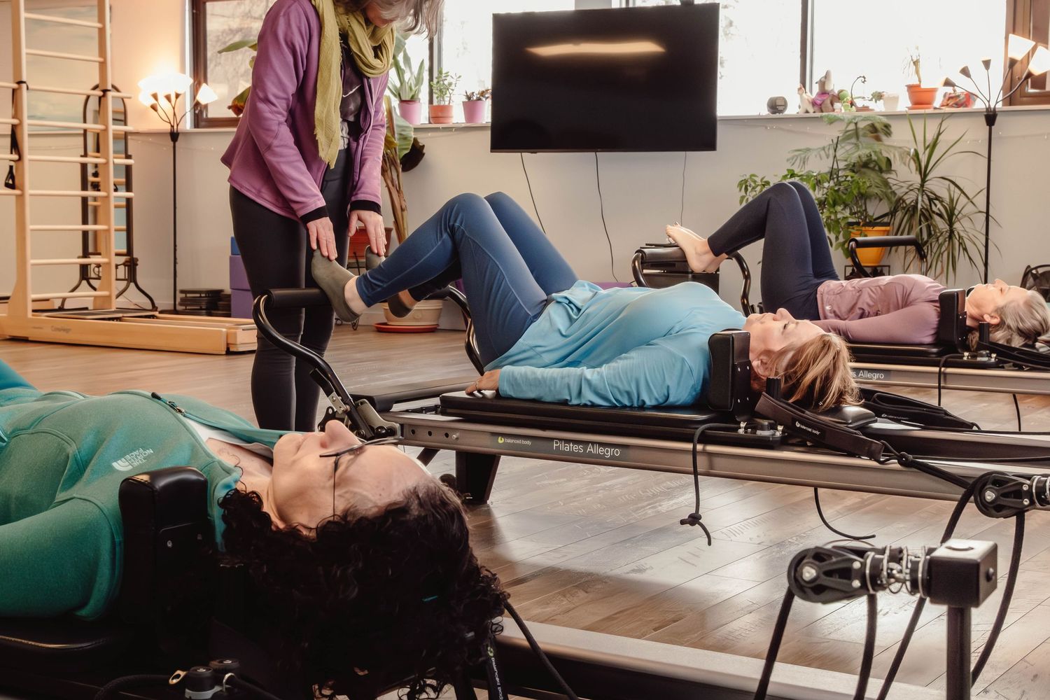 Modern Pilates studio with reformers photographed for a boutique fitness business.