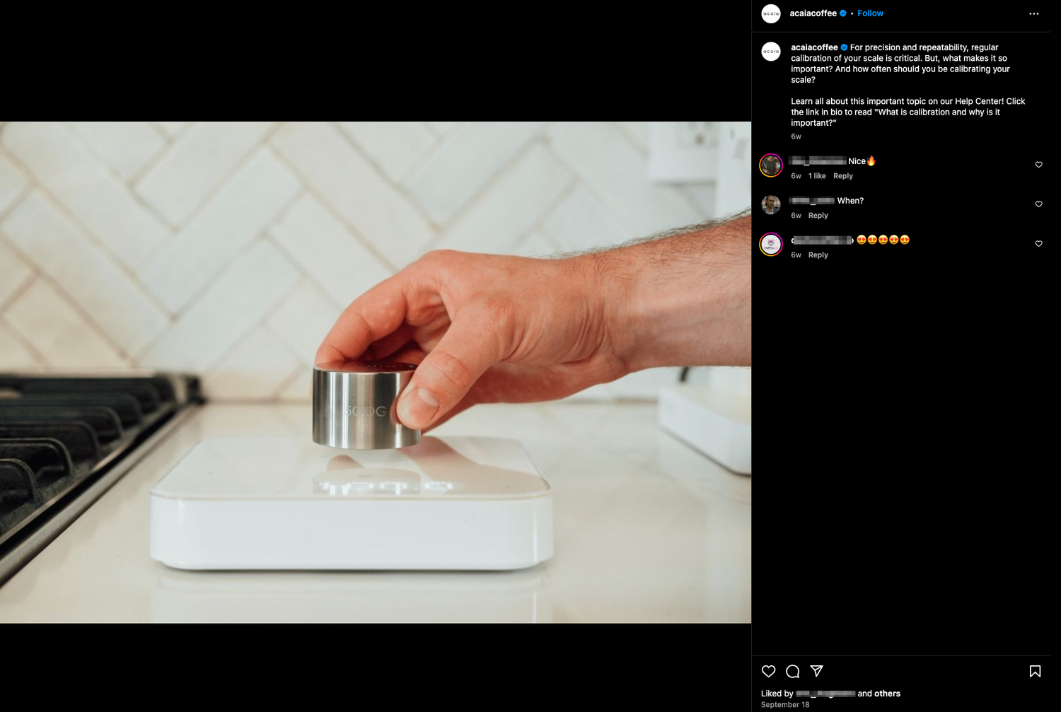 Hand adjusting settings on white coffee brewing scale on countertop.