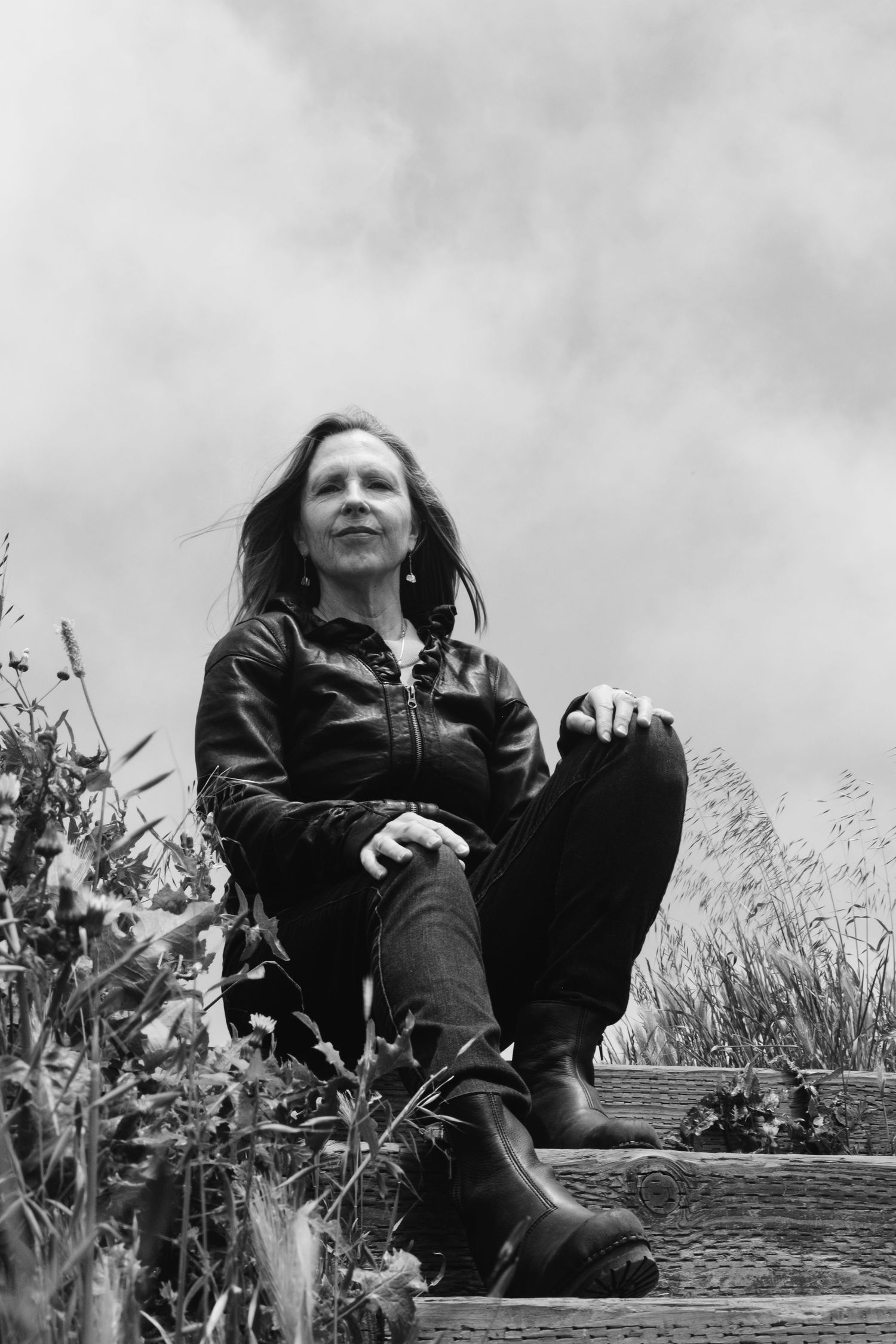 Black and white portrait of a woman in a leather jacket. Proud, serious pose. Personal branding photoshoot in Bernal Heights.