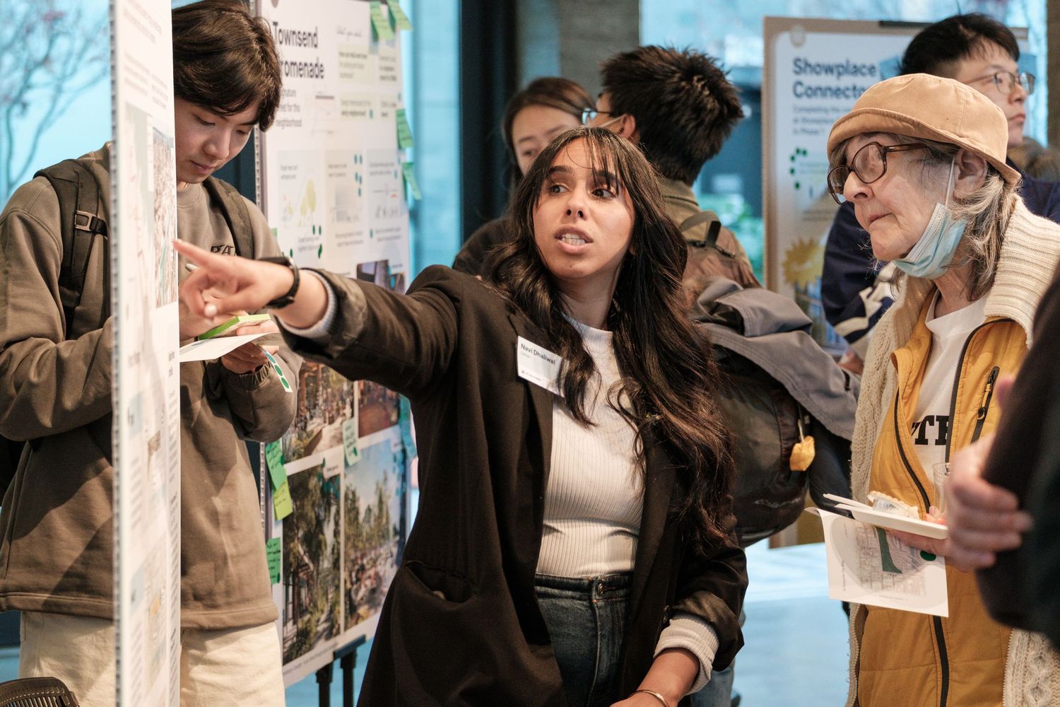 Coffee industry professionals engaged in animated discussion at an event.