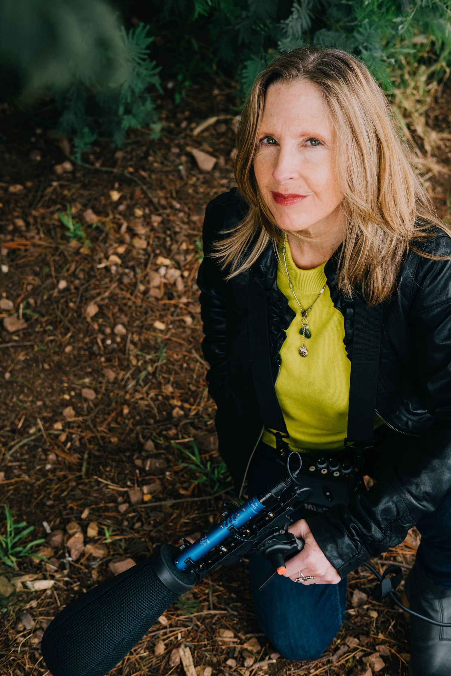 Outdoor personal branding shoot of audio producer in Bernal Heights. Holding a mic, environmental portrait/headshot, lifestyle.