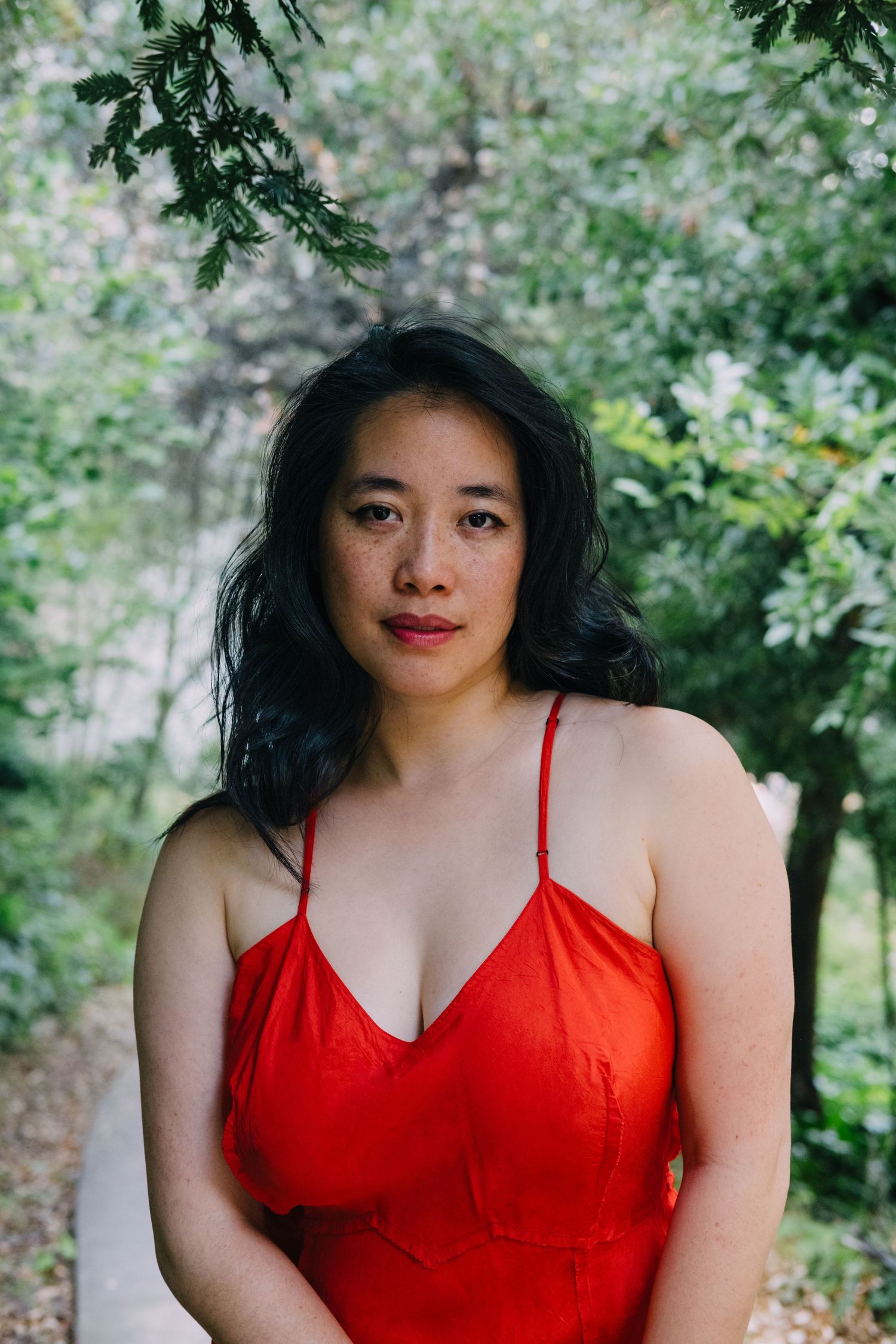 Colorful, outdoor, creative portrait of an Asian-American woman, taken by professional photographer Jenn Chen in San Francisco