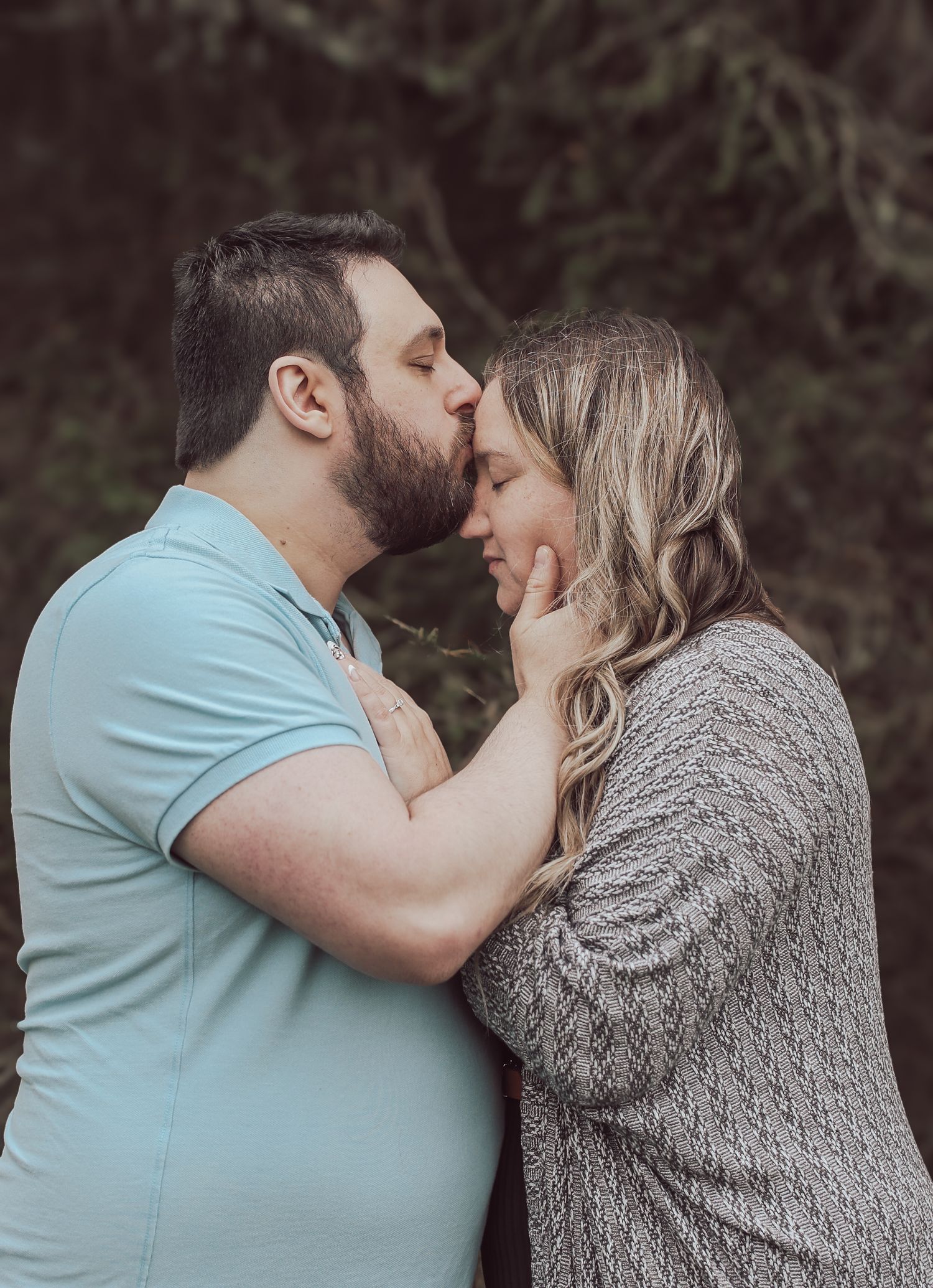 A couple in a light blue shirt and grey sweater share a tender kiss outdoors in a progressive photo sequence.